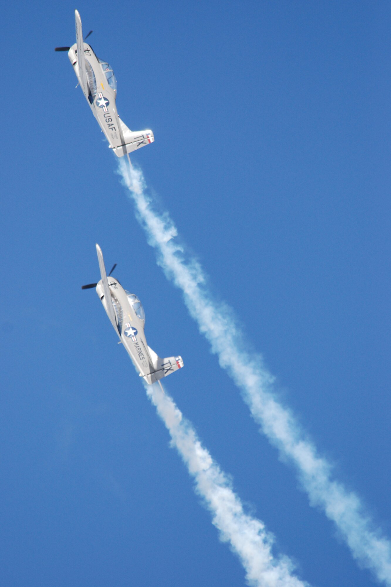 EGLIN AIR FORCE BASE, Fla. -- The Trojan Phylers, based out of Hicks Airfield, Texas, flies their T28B Trojan aircraft in front of thousands of spectators at the 2007 Eglin Air Show April 15. The first day of the air show was cancelled due to severe weather coming into the area. Although the second day was cold and windy, thousands braved the elements to watch the aerial acrobatics in the skies over Eglin. (U.S. Air Force photo by Staff Sgt. Mike Meares)