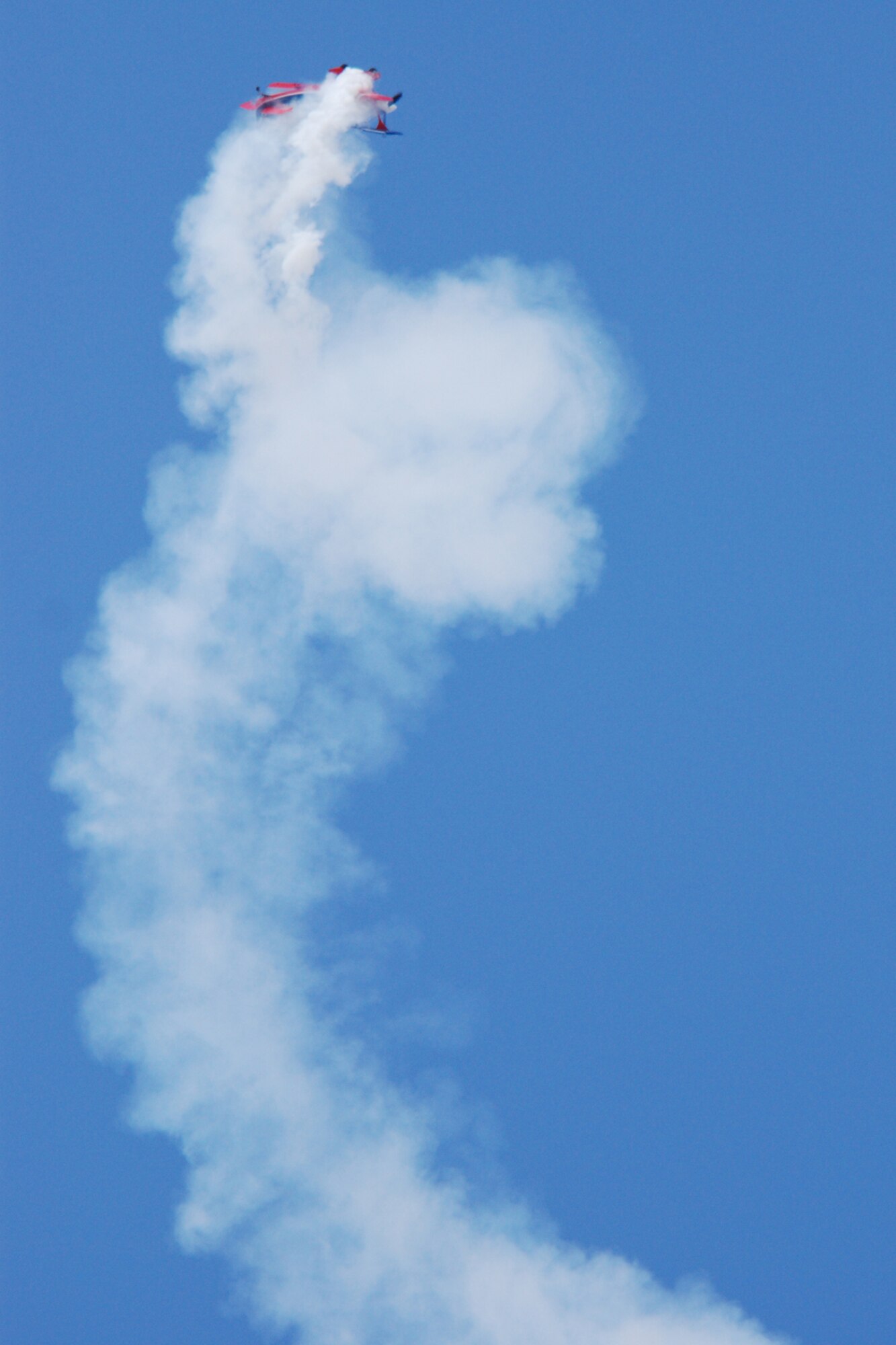EGLIN AIR FORCE BASE, Fla. -- Ed Hamill, pilot of the Air Force Reserves Biplane, performs at the 2007 Eglin Air Show April 15. His aerial acrobatics, Living the Dream air show, dives and rolls through three acts: Barnstormers, Competitors and Skydancers. The routine began with a tribute to the first flight at Kitty Hawk, N.C., and finishes with a skydancing performance. (U.S. Air Force photo by Staff Sgt. Mike Meares)