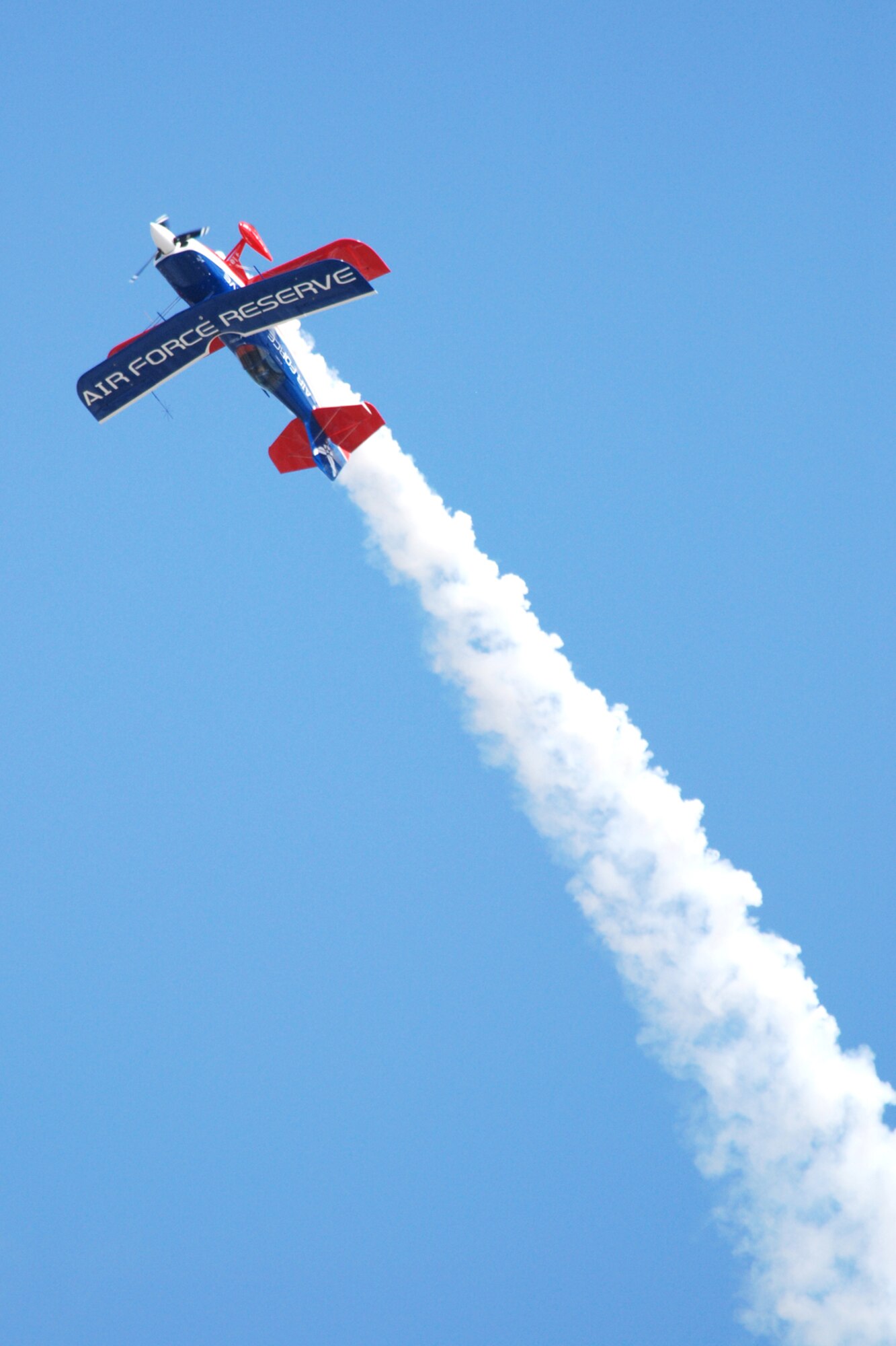 EGLIN AIR FORCE BASE, Fla. -- Ed Hamill, pilot of the Air Force Reserves Biplane, performs at the 2007 Eglin Air Show April 15. His aerial acrobatics, Living the Dream air show, dives and rolls through three acts: Barnstormers, Competitors and Skydancers. The routine began with a tribute to the first flight at Kitty Hawk, N.C., and finishes with a skydancing performance. (U.S. Air Force photo by Staff Sgt. Mike Meares)