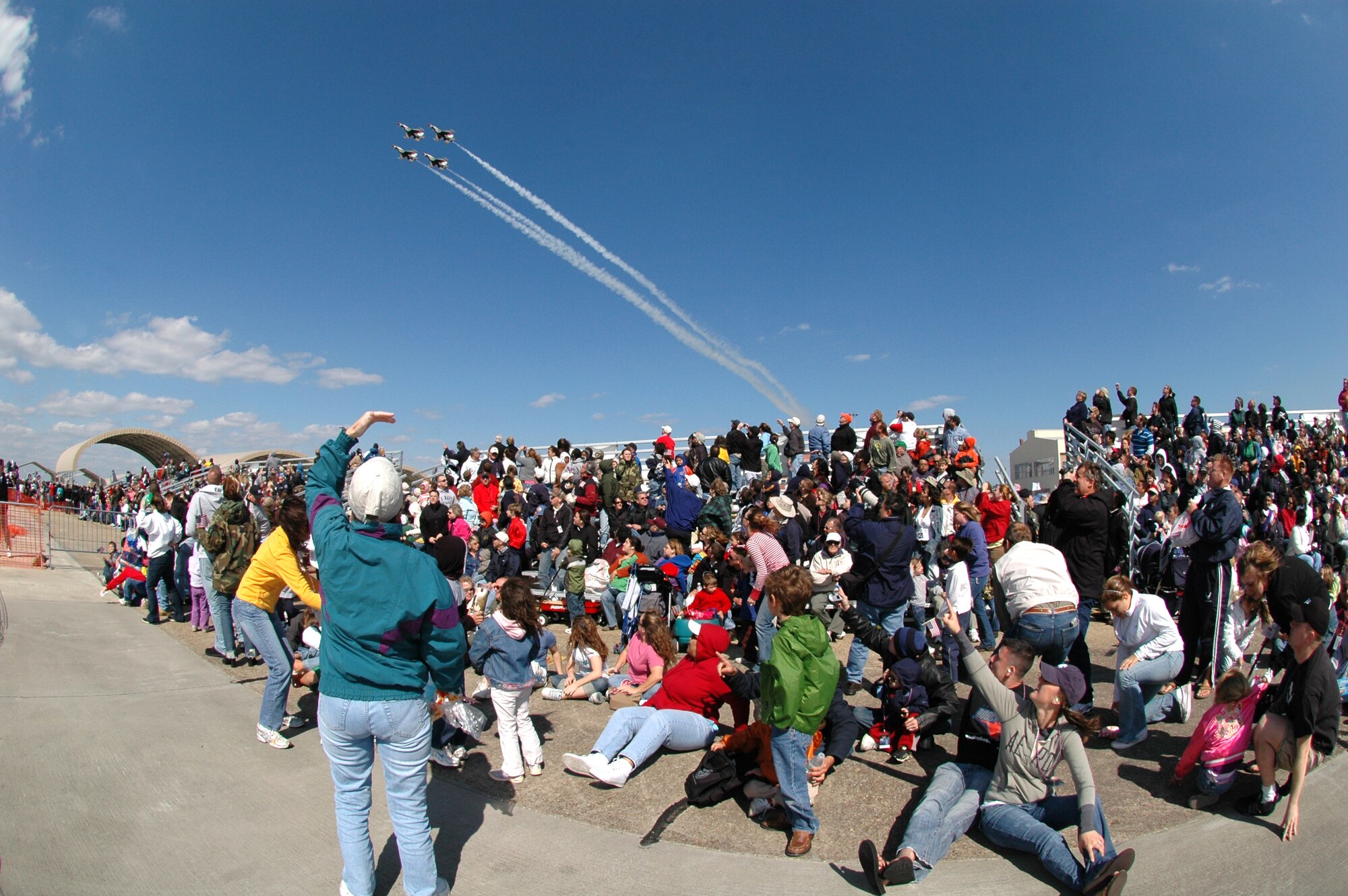 EGLIN AIR FORCE BASE, Fla. -- The U.S. Air Force Thunderbirds make their grand entrance to the 2007 Eglin Air Show April 15 to the surprise of the on-looking crowd. The first day of the air show was cancelled for safety reasons due to a severe weather threat. The winds on the back side of the storm didn't keep spectators away April 15 as the Thunderbirds performed in front of thousands of spectators to culminate the air show. (U.S. Air Force photo by Staff Sgt. Mike Meares)