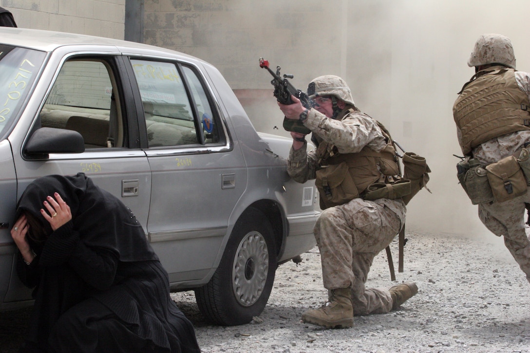 A Marine with Company I, Battalion Landing Team, 3rd Battalion, 8th Marine Regiment, 22nd Marine Expeditionary Unit, suppresses an enemy position to cover the movement of his fellow Marine during a training scenario aboard Fort Pickett, Va., April 18, 2007. The training evolution included Iraqi role-players and Hollywood-style special effects. The Marines and sailors of BLT 3/8 are scheduled to deploy as the Ground Combat Element of the 22nd MEU later this year. (U.S. Marine Corps photo by Cpl. Peter R. Miller)