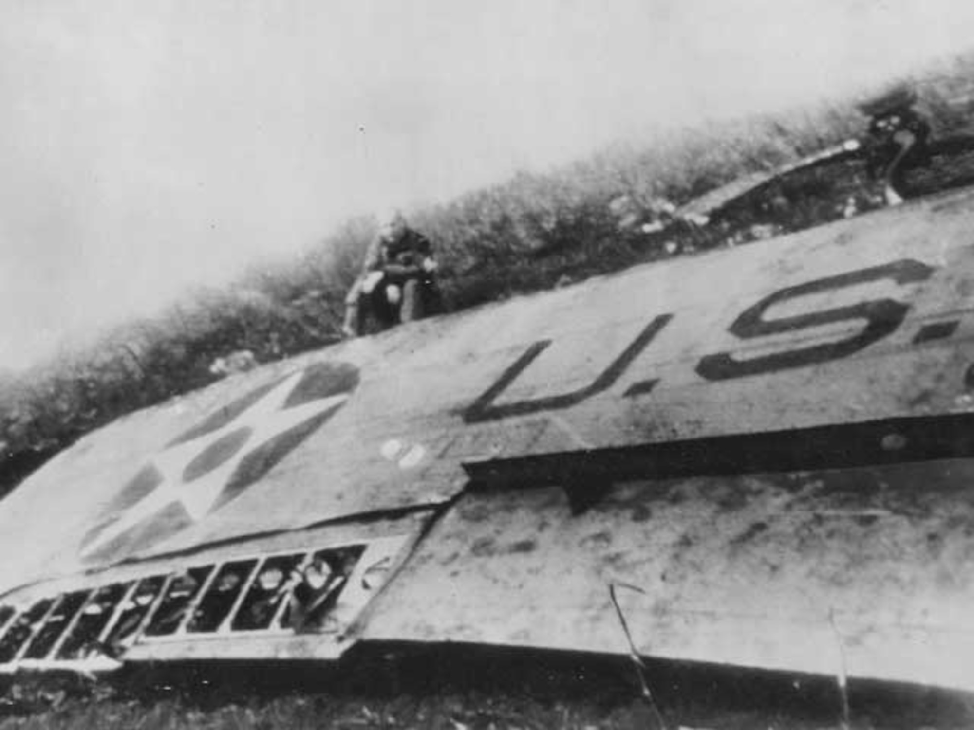 Wreckage of Major General Doolittle’s plane in China after the raid on Tokyo, April 18, 1942. Doolittle at the end of the Tokyo raid. Major General Doolittle sits by a wing of his crashed plane somewhere in China after he led the daring US air raid on Tokyo. Heading for a China airfield after the raid, several of the planes ran out of gas and crashed. (National Archives, US Navy 80-G-063587).