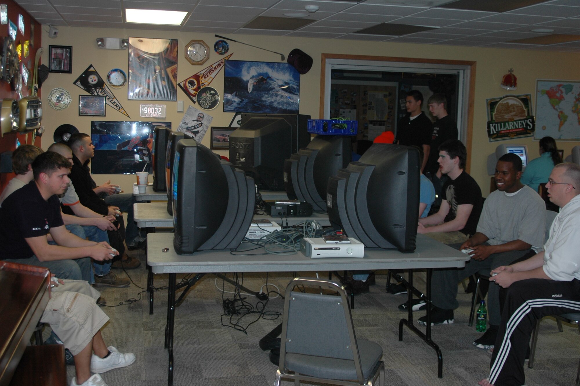 Participants surround the LAN during the April 13 Halo 2 team tournament at the Black Hills Community Center. The tournament pitted eight teams of two against one another in an all out battle royal. The winners of the tournament were Senior Airman Bond Aulik, 28th Civil Engineer Squadron readiness journeyman and Senior Airman Rico Hooker, 28th CES heating and ventilation journeyman. (U.S. Air Force photo/Airman Nathan Riley)