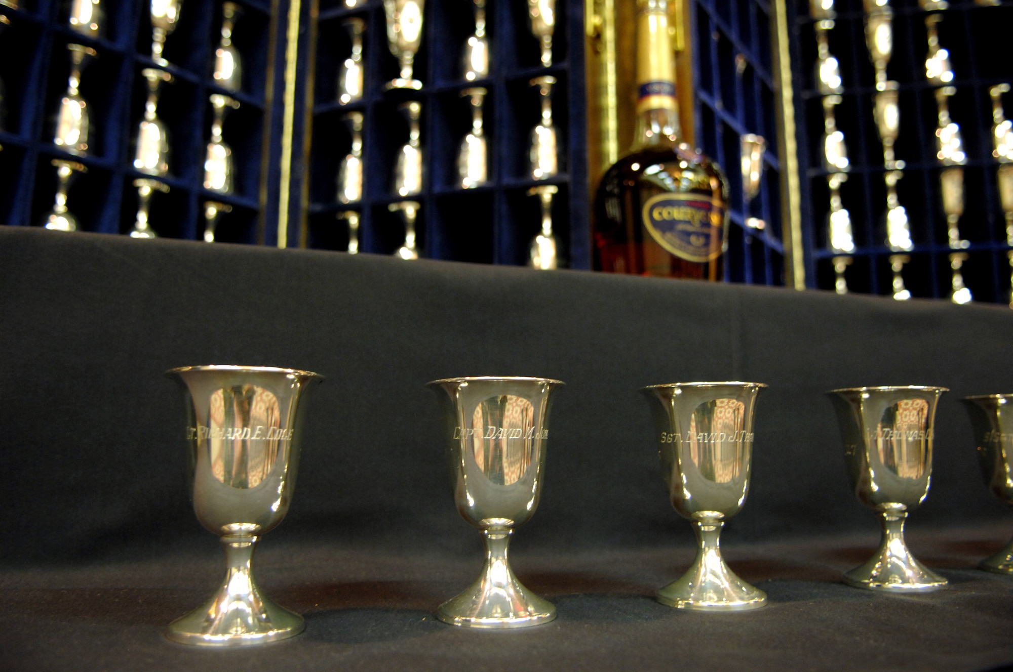 Silver goblets are positioned for a Doolittle Raider toast honoring fallen Raiders April 18 in San Antonio, commemorating the 65th Anniversary of the Doolittle Tokyo Raid in 1942. There are 80 goblets representing all 80 Doolittle Raiders. When a Raider dies, his goblet is turned over in the case. When there are but two Raiders left, the two men will open a bottle of cognac, vintage 1896 (the year Doolittle was born) and give a final toast to their departed comrades. Fourteen of the 80 Raiders are still alive. (U.S. Air Force photo/Staff Sgt. Brian Ferguson)
