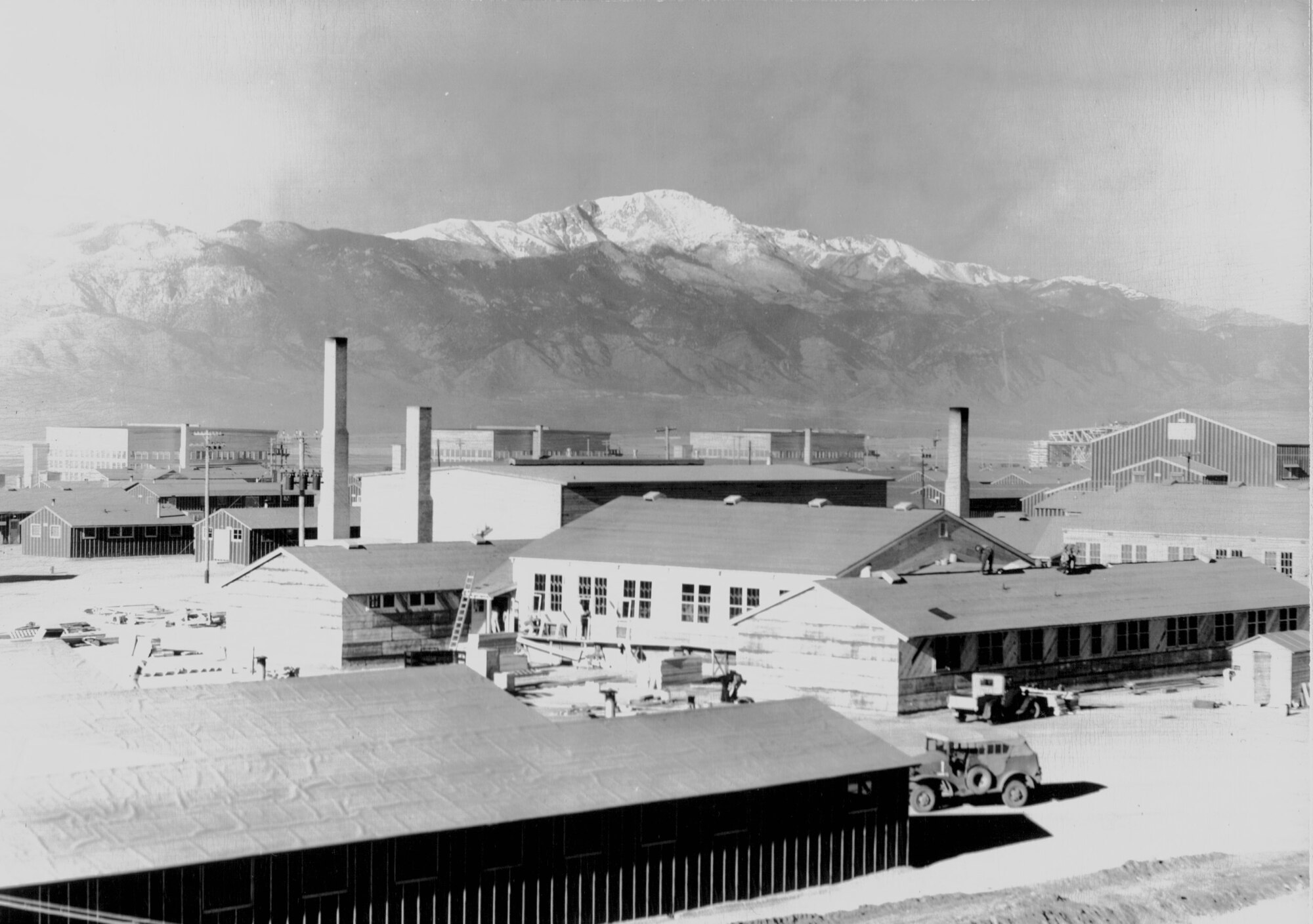 Building 365 under construction in early 1943.  This building still stands today, as do the hangars in the background. (U.S. Air Force photo)