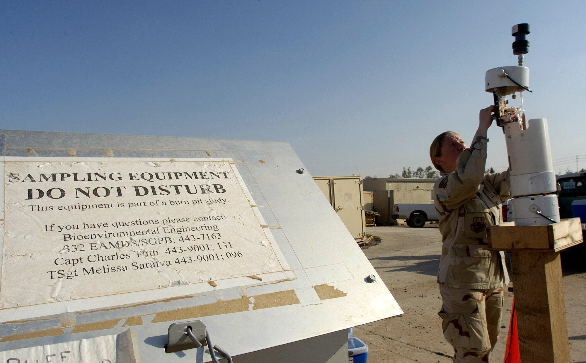 Tech. Sgt. Melissa Saraiva checks a monitoring device April 13 at Balad Air Base, Iraq, for common pesticides and other environmental hazardous chemicals in the air.  Sergeant Saraiva is the bioenvironmental engineer flight NCOIC. Bioenvironmental engineers perform environmental, occupational and radiological surveillance in order to protect and maintain a healthy work force, and they serve as mission enhancers during emergency management response operations. (U.S. Air Force photo/Airman 1st Class Nathan Doza) 