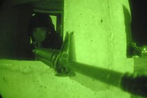 MINOT AIR FORCE BASE, N.D. – Senior Airman Christopher Vanaken, 5th Aircraft Maintenance Squadron and 5th Security Forces Squadron augmentee, scans the flight line from a defense fighting position during an exercise April 17 here. Augmentees are volunteer Airmen from a wide variety of Air Force career fields who assist the 5th SFS by performing base security duties; enabling regular SFS personnel to perform more proactive roles in air base defense. Augmentees are given specialty training in weapons, possible scenarios, rules of engagement and the use of force prior to being cleared for duty as an augmentee.  (U.S. Air Force photos by Senior Airman Christopher Boitz)