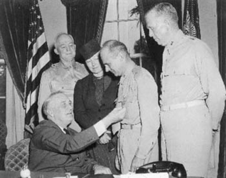 WASHINGTON D.C. -- President Franklin Delano Roosevelt pins the Congressional Medal of Honor on Brig. Gen. James "Jimmy" Doolittle.  The medal was awarded for a raid Gen. Doolittle led on Tokyo following the Japanese attack on Pearl Harbor.  (Courtesy photo)