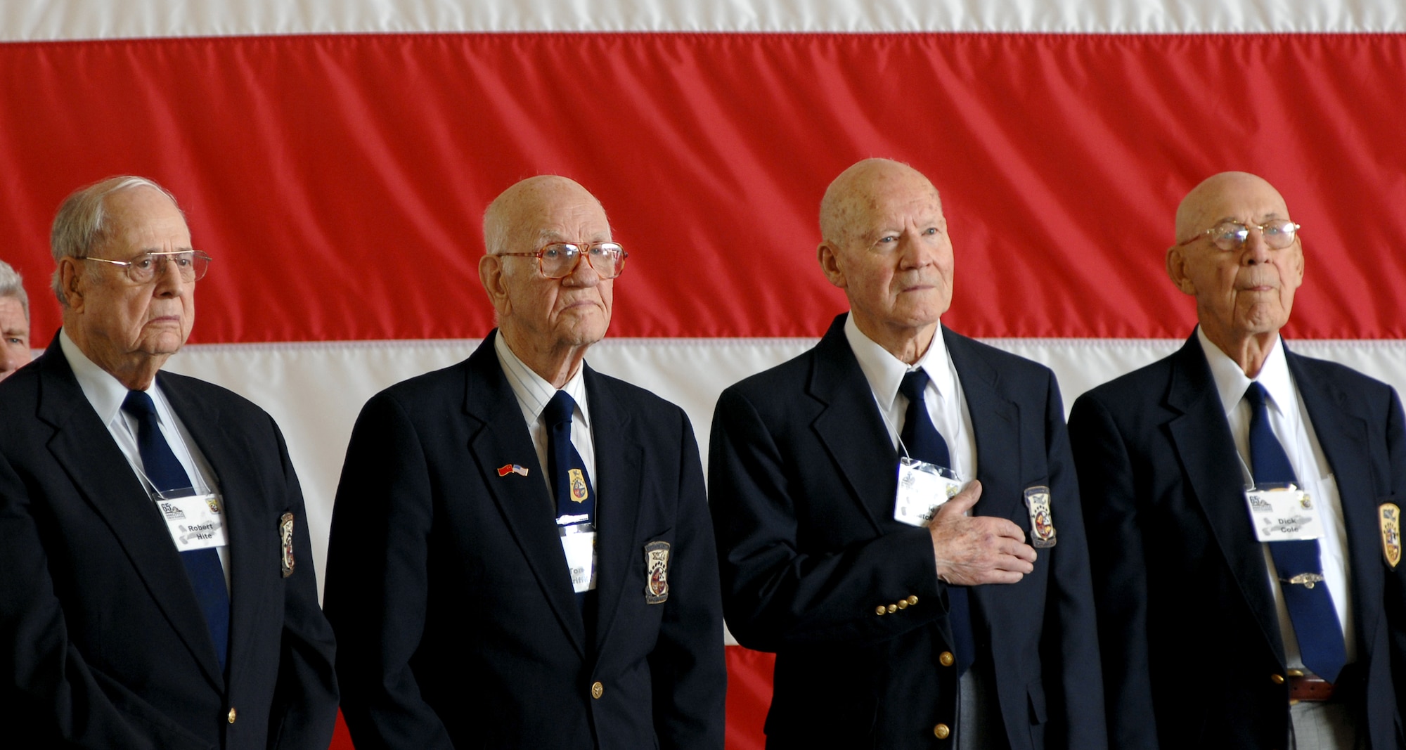 (Left to right) Doolittle Raiders Robert Hite, Tom Griffin, Dave Thatcher and Dick Cole stand for the national anthem during a ceremony honoring the raiders and celebrating the 65th Anniversary of the raid April 17 at Randolph Air Force Base, Texas. The Doolittle Raiders flew B-25 Mitchell bombers over Japan April 18, 1942, just four months after Pearl Harbor. (U.S. Air Force photo/Staff Sgt. Brian Ferguson) 
