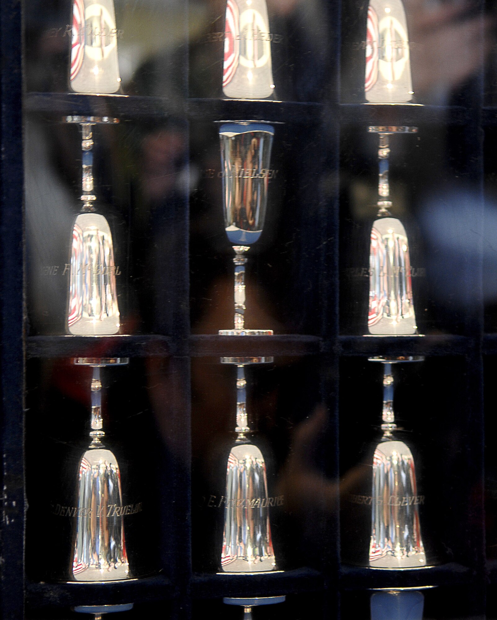 The Doolittle Tokyo Raiders Silver Goblets are displayed during a ceremony honoring the raiders and celebrating the 65th Anniversary of the raid April 17 at Randolph Air Force Base, Texas. There are 80 goblets representing all 80 Doolittle raiders. When a raider dies, his goblet is turned over in the case. There are 14 surviving raiders. The Doolittle Raiders flew B-25 Mitchell bombers over Japan April 18, 1942, just four months after Pearl Harbor. (U.S. Air Force photo/Staff Sgt. Brian Ferguson) 
