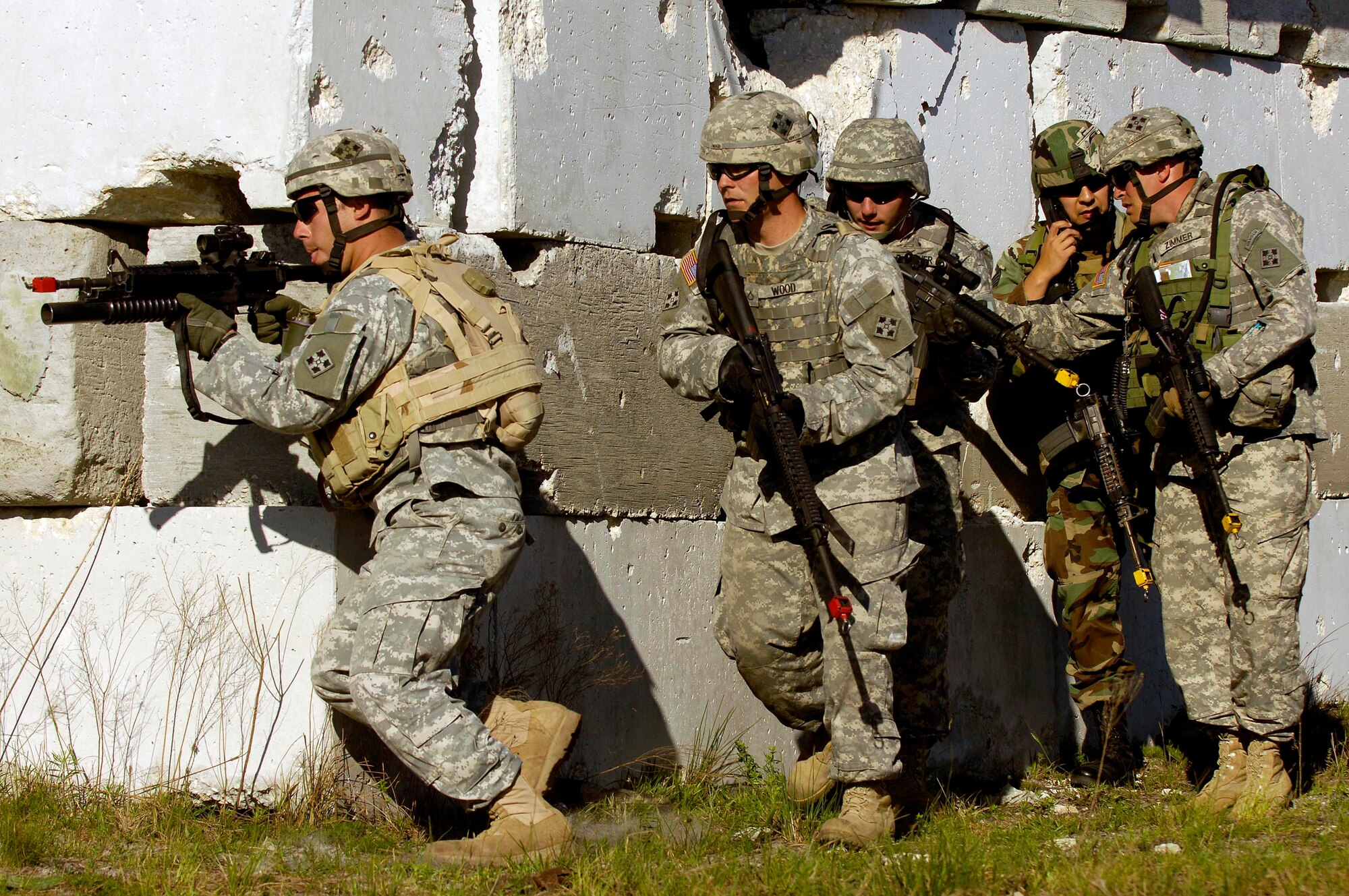 A U.S. Air Force Joint Terminal Attack controller integrates with members of Scout Platoon 3-67 AR, 4th ID, Ft. Hood, Texas, receive on April 16 durinf Atlantic Strike V. Atlantic Strike is a joint forces training event involving Joint Terminal Attack Controllers from the U.S. Army, Air Force and Marines  and is held semi-annually at Avon Park Air Ground training Complex, Avon Park, FL. (U.S. Air Force photo/Staff Sgt. Stephen J. Otero)