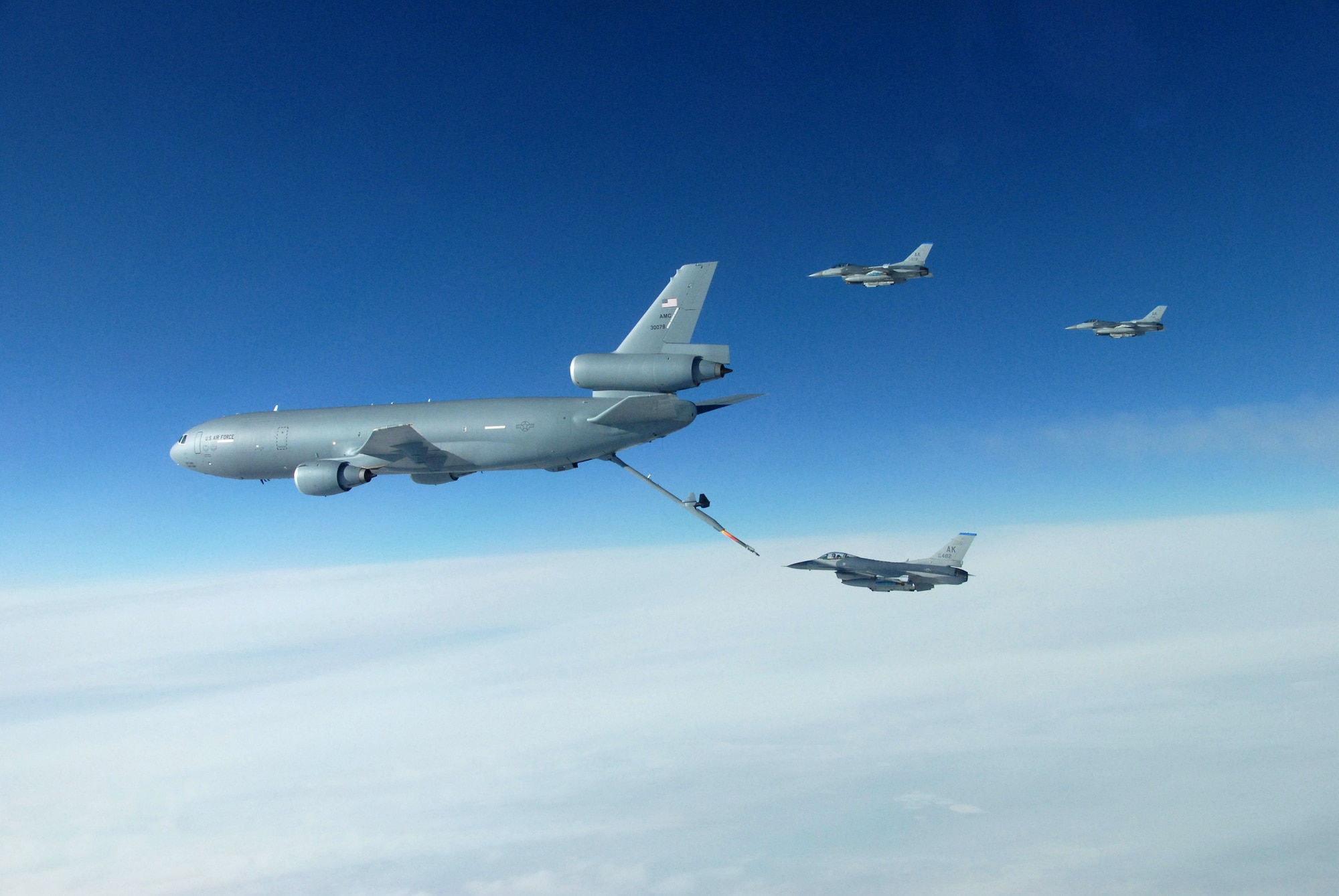 Three F-16 Fighting Falcons refuel behind a KC-10 Extender over the Pacific Alaska Range Complex April 13 during Red Flag-Alaska 07-1. Red Flag-Alaska is a Pacific Air Forces-directed field training exercise flown under simulated air combat conditions. (U.S. Air Force photo/Master Sgt. Robert Wieland) 
