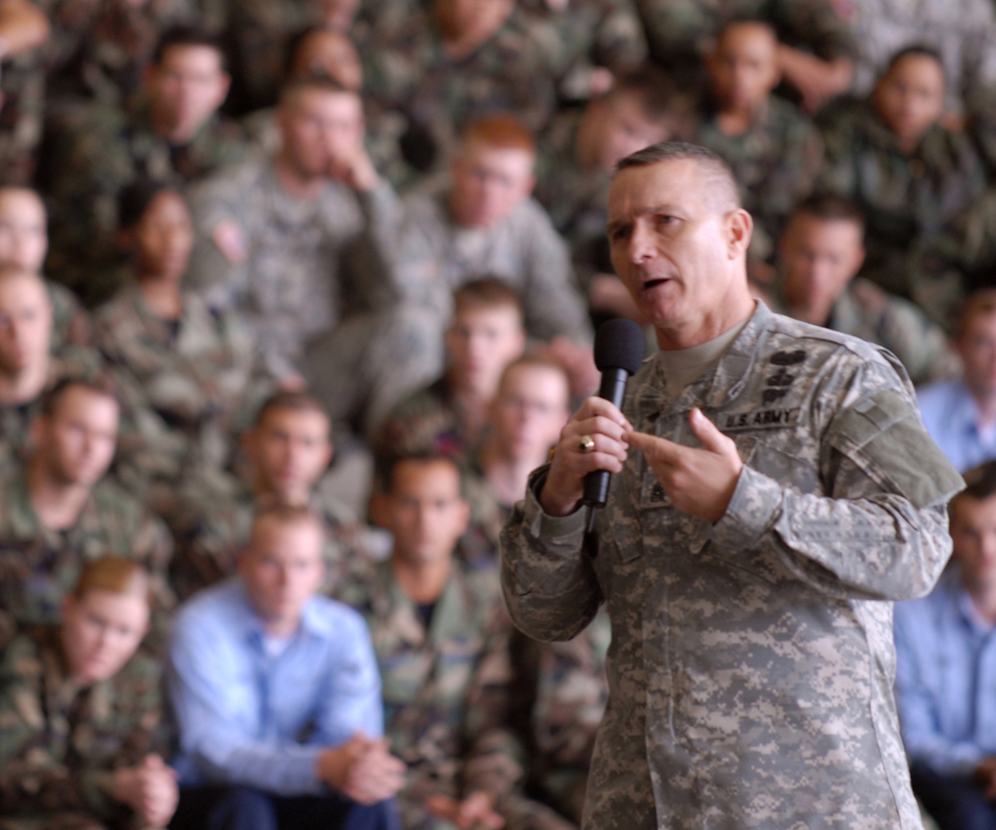 KADENA AIR BASE, Japan -- Command Sgt. Major William Gainey, the senior enlisted advisor to the Chairman of the Joint Chiefs of Staff, talks to Kadena Airmen, Marines, Soldiers and Sailors April 11. Sergeant Major Gainey, the first enlisted leader to be appointed as SEAC, toured Okinawa military installations.