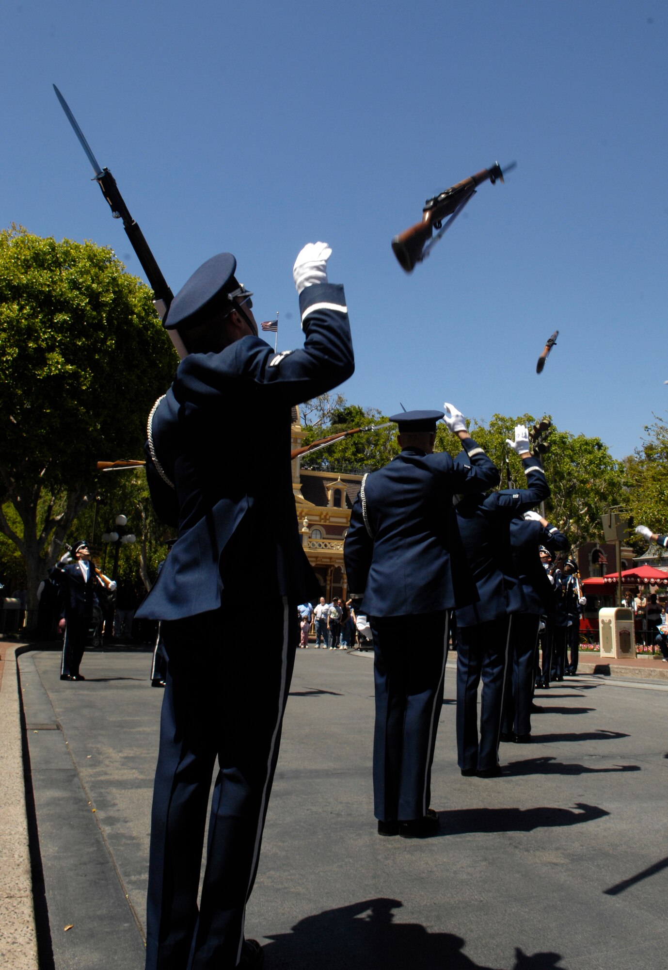 The Air Force Honor Guard Drill Team performs the newly added 'X-mix' maneuver in their 16 Man drill performance at Disneyland Resort in Aneheim, Calif., 18 April 2007. The Drill Team is the traveling component of the Air Force Honor Guard and tours Air Force bases world wide showcasing the precision of today's Air Force to recruit, retain, and inspire Airmen for the Air Force mission. (U.S. Air Force photo by Senior Airman Daniel R. DeCook)(Released)