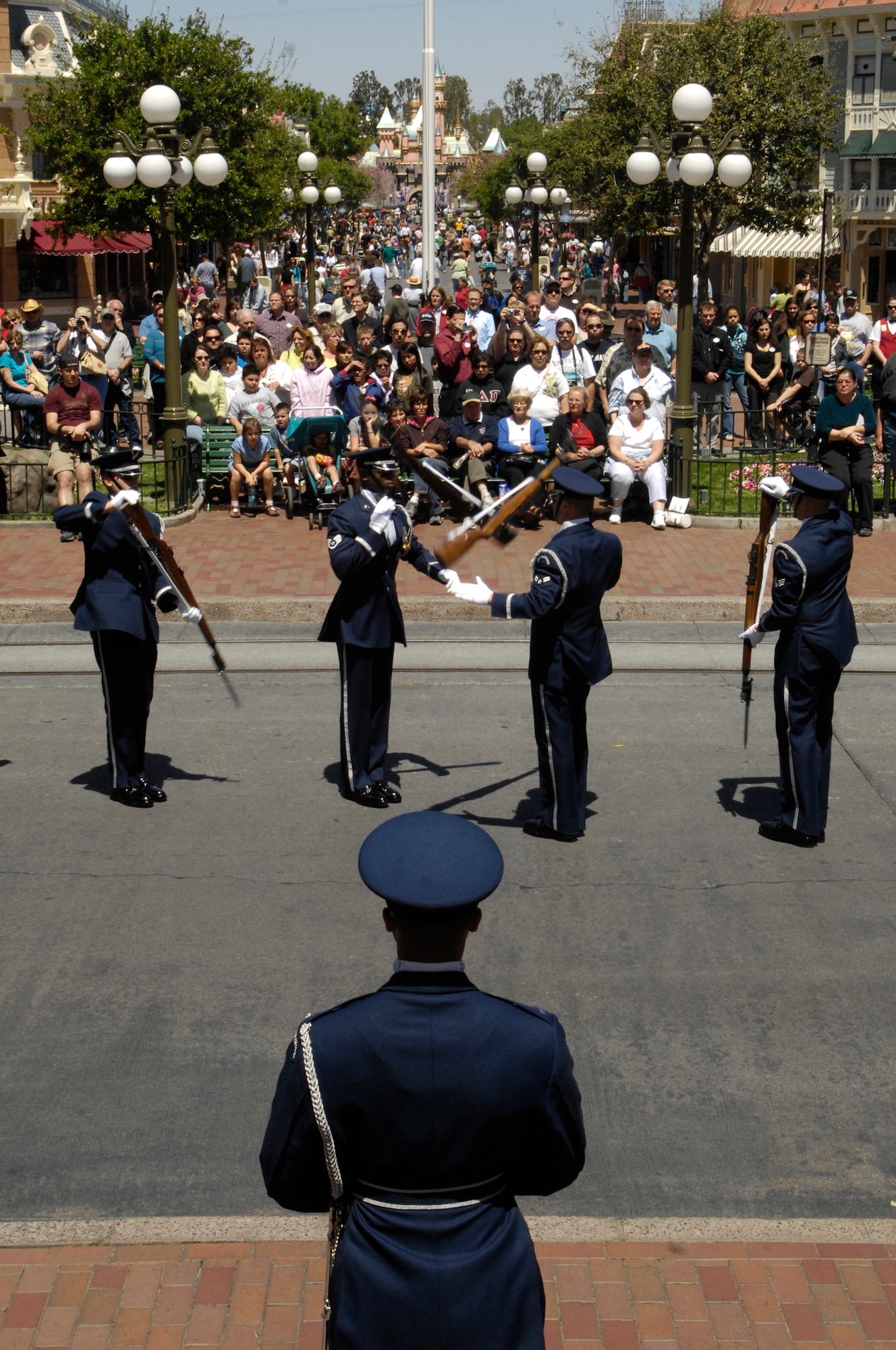The Air Force Honor Guard Drill Team performs their 16 Man drill routine at Disneyland Resort in Aneheim, Calif., 18 April 2007. The Drill Team is the traveling component of the Air Force Honor Guard and tours Air Force bases world wide showcasing the precision of today's Air Force to recruit, retain, and inspire Airmen for the Air Force mission.