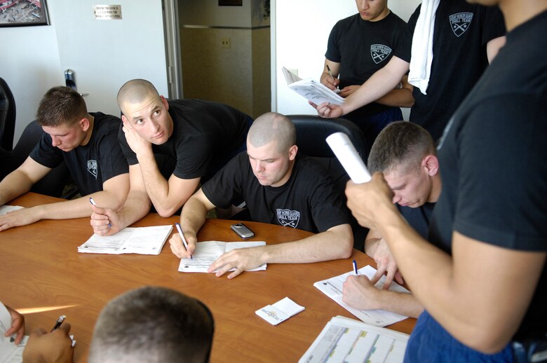 Members of the Air Force Honor Guard Drill Team conduct the debrief at the end of their duty day during their recent California Tour.  The Drill Team is the traveling component of the Air Force Honor Guard and tours Air Force bases world wide showcasing the precision of today's Air Force to recruit, retain, and inspire Airmen for the Air Force mission.(U.S. Air Force photo by Senior Airman Daniel R. DeCook)(Released)