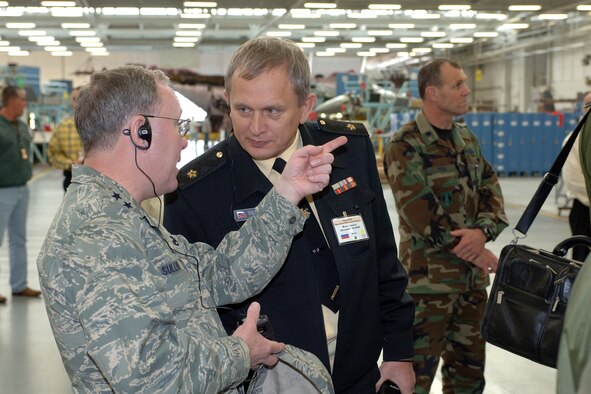 Maj. Gen. Kevin Sullivan, Ogden Air Logistics Center commander, answers Defense Attaché group member Russian Rear Admiral Alexander Agapov’s question about F-16 Phase Maintenance here April 11. Photo by Alex R. Lloyd
