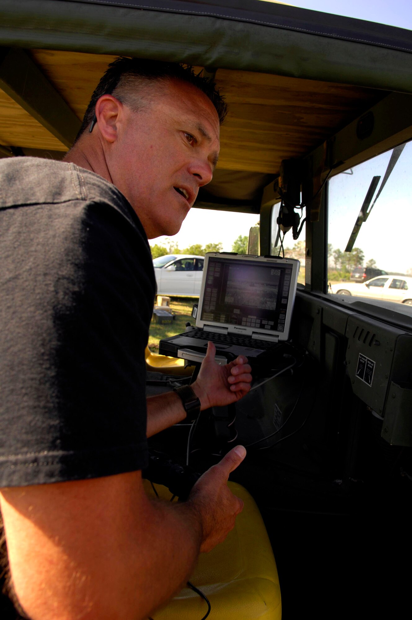 Bob Raulerson, a marketing manager from Northrop Grumman, demonstrates the capabilities of "Venom", a remote controlled lightweight laser designator rangefinder prior to using it in Atlantic Strike 5 on April 17.(U.S. Air Force photo by Staff Sgt. Stephen J. Otero)