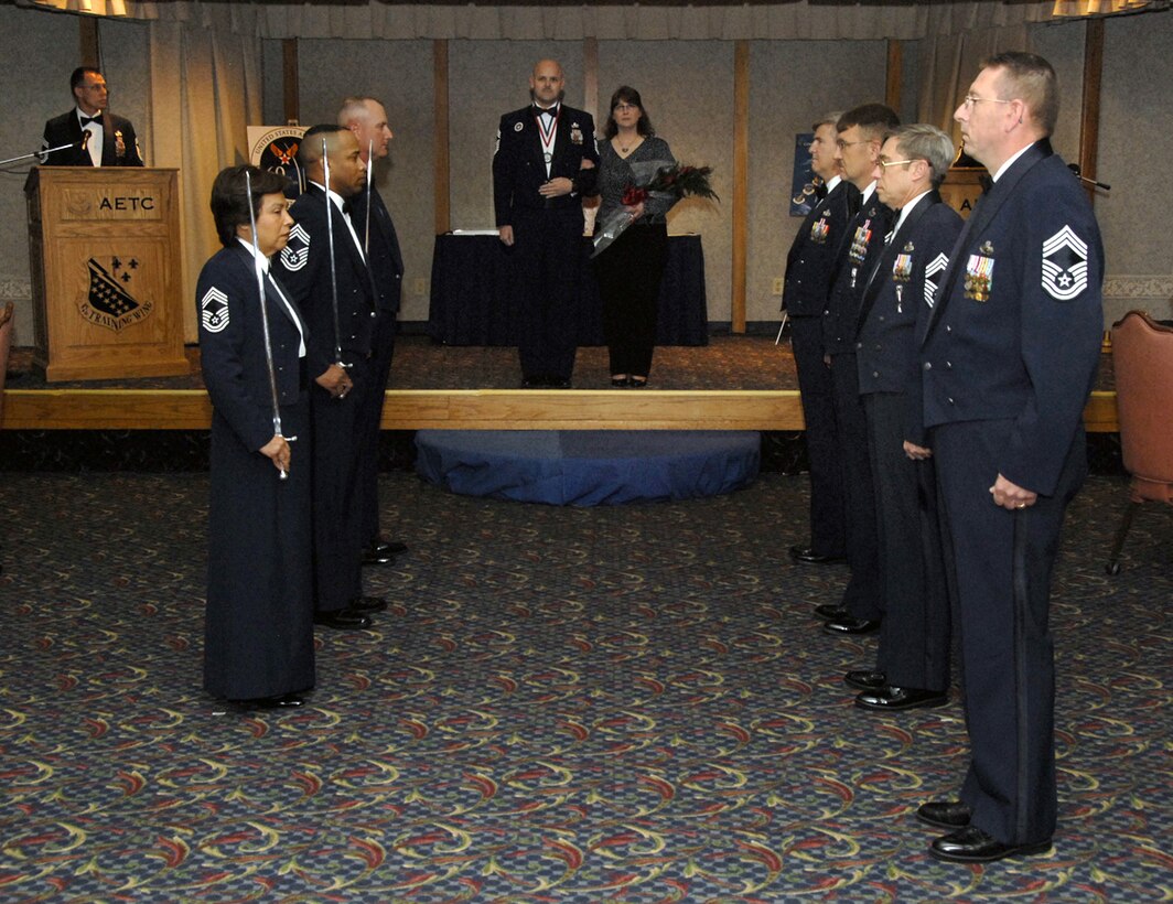 Members of the Sheppard chiefs group stand ready to welcome in their newest member, Chief Master Sgt. Richard Price, at the Chief Master Sergeant Recognition Ceremony April 13. (U.S. Air Force photo/Sandy Wassenmiller)