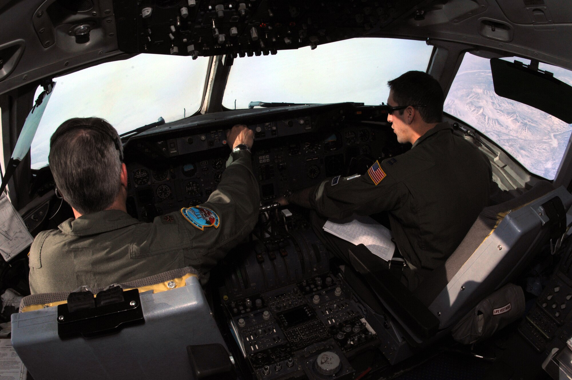 EIELSON AIR FORCE BASE, Alaska -- Major Argyle (left), KC-10 Aircraft Commander, and Captain Capodicasa, KC-10 pilot, 78th Air Refueling Squadron, McGuire Air Force Base, New Jersey fly over the Pacific Alaska Range Complex here as call sign "Shaman Five One" during a refueling mission on 18 April in support of Red Flag-Alaska 07-1. Red Flag-Alaska is a Pacific Air Forces-directed field training exercise for U.S. forces flown under simulated air combat conditions. (U.S. Air Force photo by Staff Sgt. Joshua Strang)