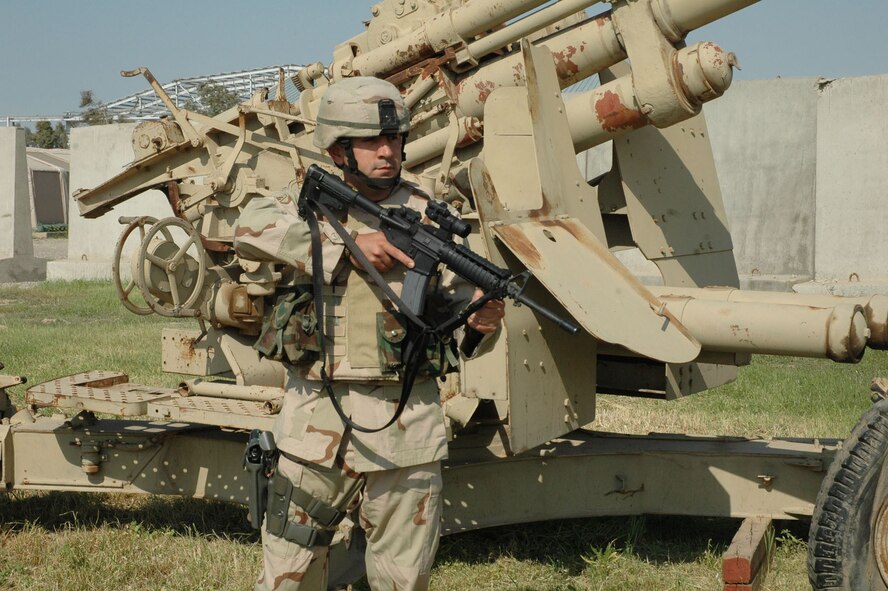 KIRKUK REGIONAL AIRPORT, Iraq -- Staff Sgt. Loren Mount, of the 506th Expeditionary Security Forces Squadron, keeps a vigilant eye while on duty. Sergeant Mount is deployed here from the 910th Security Forces Squadron, Youngstown Air Reserve Station, Ohio. (U.S. Air Force photo/Tech. Sgt. Kevin Williams)