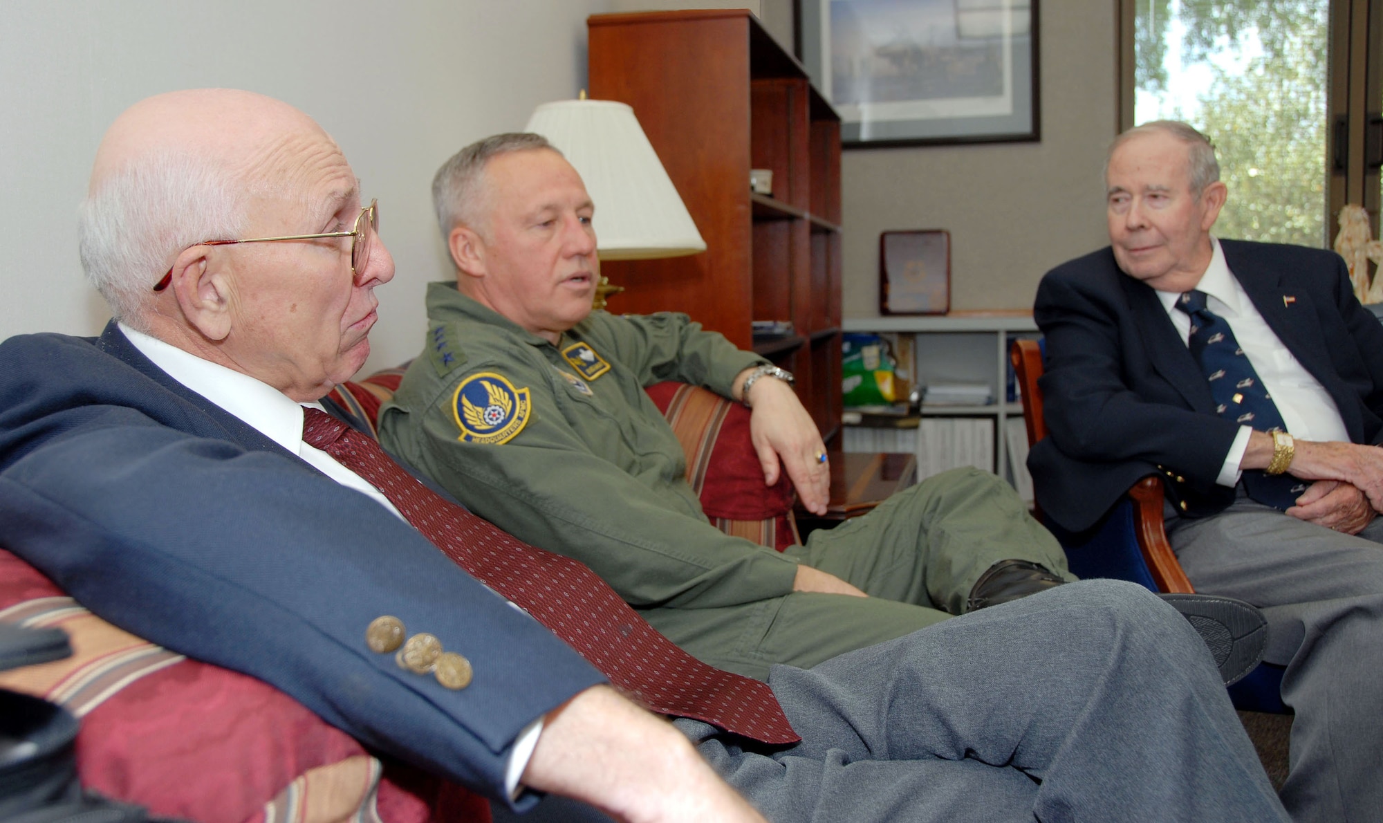 Gen. Bruce Carlson, commander, Air Force Materiel Command, talks with retired Lt. Cols. William Desmond Jr. (left) and Philip Alker during a visit to Maxwell Air Force Base, Ala., April 17. General Carlson reunited with his two former Det. 420 - University of Minnesota Duluth ROTC instructors after more than 36 years. General Carlson was a distinguished graduate from the detachment in 1971. (Air Force photo by Tech. Sgt. Scott Moorman)