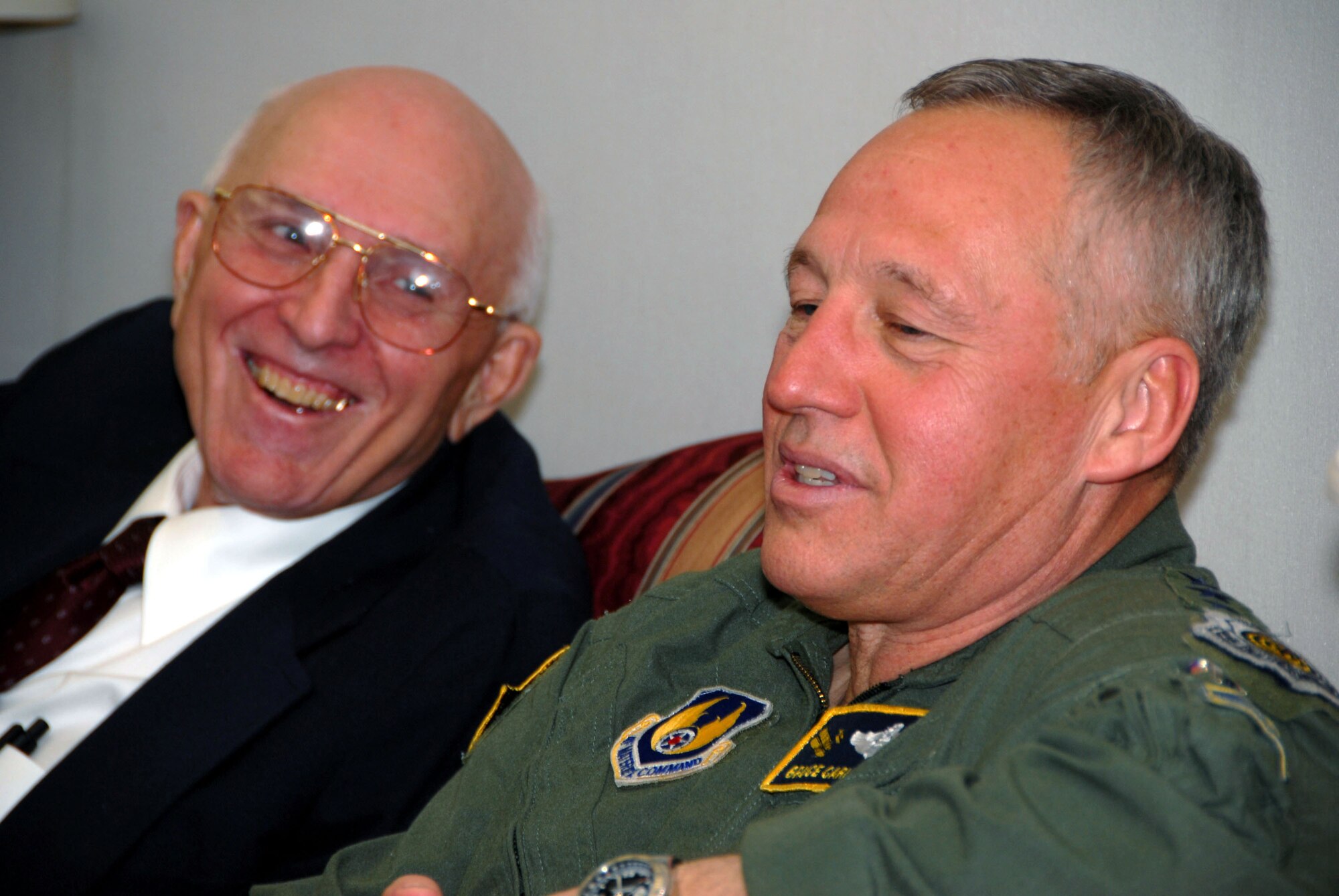 Gen. Bruce Carlson, commander, Air Force Materiel Command, shares a laugh with retired Lt. Col. William Desmond Jr. during a visit to Maxwell Air Force Base, Ala., April 17. General Carlson reunited with two of his former ROTC instructors after more than 36 years. (Air Force photo by Tech. Sgt. Scott Moorman)