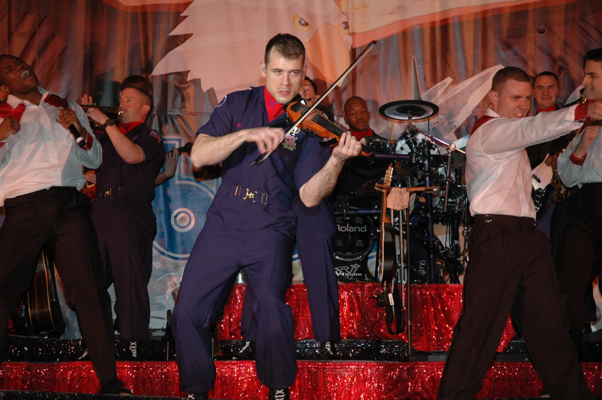 Capt. Alex Ruiz plays “The Devil went down to Georgia” on the fiddle for the premier opening of Tops in Blue’s 2007 tour Thursday, April 19, at Manas Air Base, Kyrgyzstan. Based out of Lackland Air Force Base, Texas, Tops in Blue is an expeditionary entertainment unit which provides quality entertainment from within Air Force resources for the Air Force family, with priority to Air Force personnel stationed worldwide at remote and deployed locations while simultaneously promoting community relations, supporting recruiting efforts and serving as ambassadors for the United States of America and the United States Air Force.  (Air Force Photo/Master Sgt. Daniel Nathaniel)