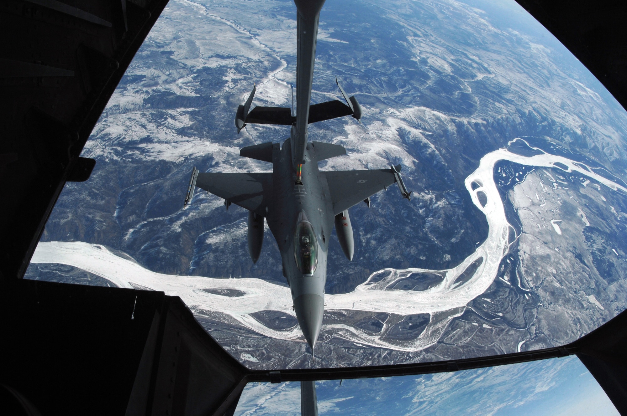 EIELSON AIR FORCE BASE, Alaska -- An F-16C, 18th Fighter Squadron "Blue Foxes", Eielson Air Force Base, Alaska, refuels from KC-10 Extender, call sign "Shaman Five One" during a refueling mission here on 18 April in support of Red Flag-Alaska 07-1. The 18th Fighter Squadron conducts air operations for combat-ready F-16 aircraft, working closely with 355th Fighter Squadron to provide close air support, forward air control (airborne), battlefield air interdiction, and offensive counter air. Red Flag-Alaska is a Pacific Air Forces-directed field training exercise for U.S. forces flown under simulated air combat conditions. (U.S. Air Force photo by Staff Sgt. Joshua Strang)