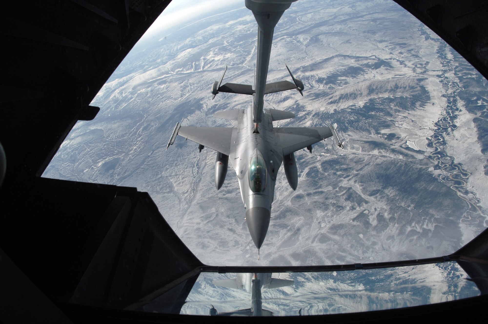 EIELSON AIR FORCE BASE, Alaska -- An F-16C, 18th Fighter Squadron "Blue Foxes", Eielson Air Force Base, Alaska, refuels from KC-10 Extender, call sign "Shaman Five One" during a refueling mission here on 18 April in support of Red Flag-Alaska 07-1. The 18th Fighter Squadron conducts air operations for combat-ready F-16 aircraft, working closely with 355th Fighter Squadron to provide close air support, forward air control (airborne), battlefield air interdiction, and offensive counter air. Red Flag-Alaska is a Pacific Air Forces-directed field training exercise for U.S. forces flown under simulated air combat conditions. (U.S. Air Force photo by Staff Sgt. Joshua Strang)