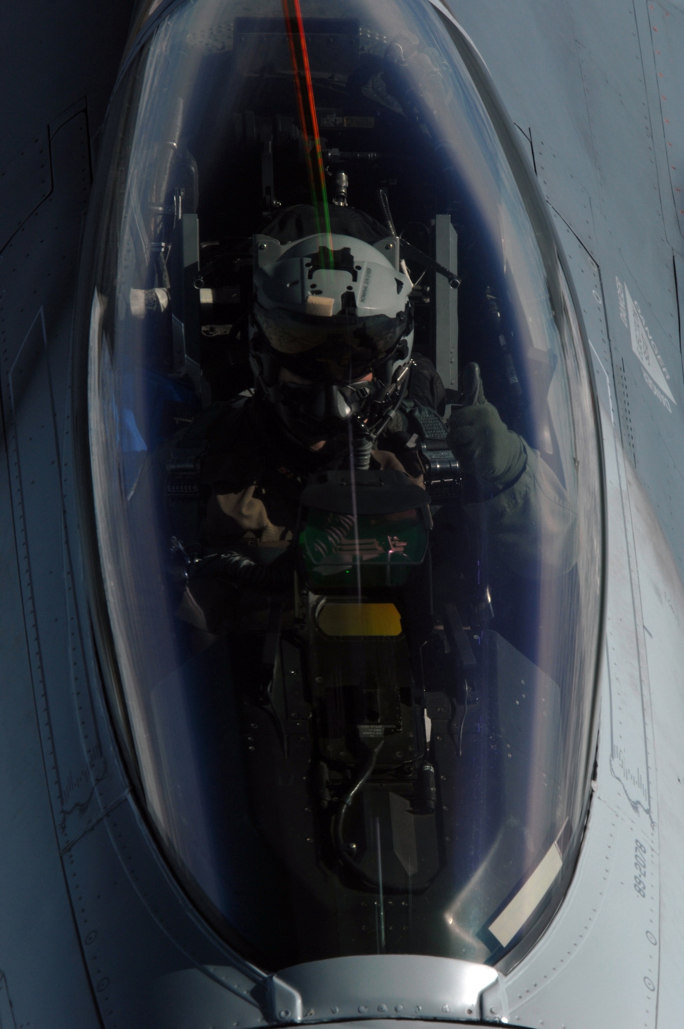 EIELSON AIR FORCE BASE, Alaska -- An F-16 pilot, 18th Fighter Squadron "Blue Foxes", Eielson Air Force Base, Alaska, gives the thumbs up during refueling from KC-10 Extender, call sign "Shaman Five One" during a refueling mission here on 18 April in support of Red Flag-Alaska 07-1. The 18th Fighter Squadron conducts air operations for combat-ready F-16 aircraft, working closely with 355th Fighter Squadron to provide close air support, forward air control (airborne), battlefield air interdiction, and offensive counter air. Red Flag-Alaska is a Pacific Air Forces-directed field training exercise for U.S. forces flown under simulated air combat conditions. (U.S. Air Force photo by Staff Sgt. Joshua Strang)