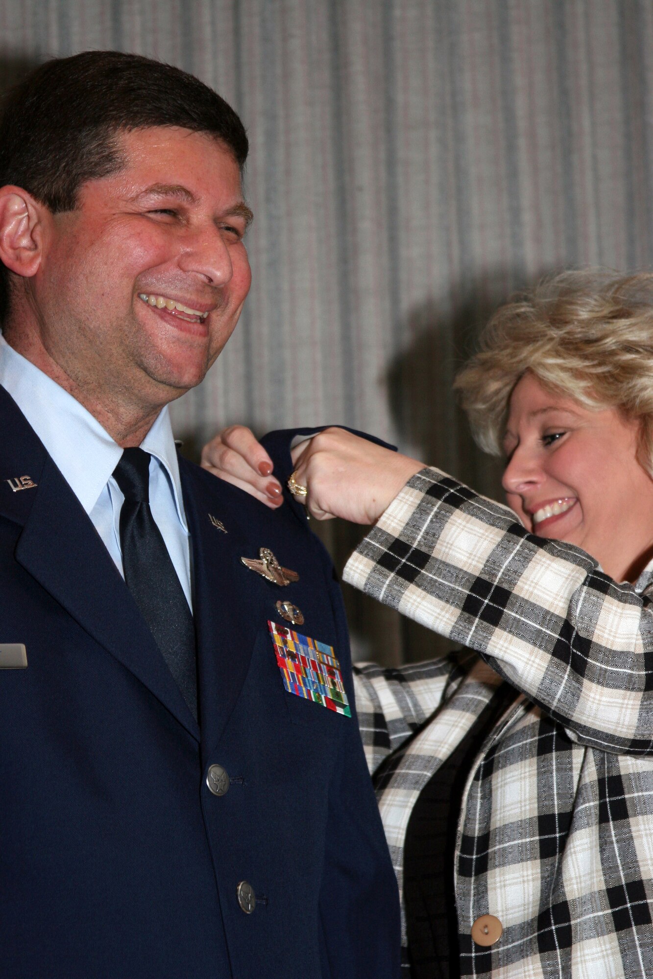 GRISSOM AIR RESERVE BASE, Ind.--  Brian Dobbert, 434th Operations Group deputy commander is all smiles as his wife Barbie pins on his new colonel insignia during the April unit training assembly. (U.S. Air Force photo/Senior Airman Omar Delacruz)