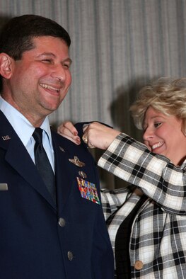 GRISSOM AIR RESERVE BASE, Ind.--  Brian Dobbert, 434th Operations Group deputy commander is all smiles as his wife Barbie pins on his new colonel insignia during the April unit training assembly. (U.S. Air Force photo/Senior Airman Omar Delacruz)