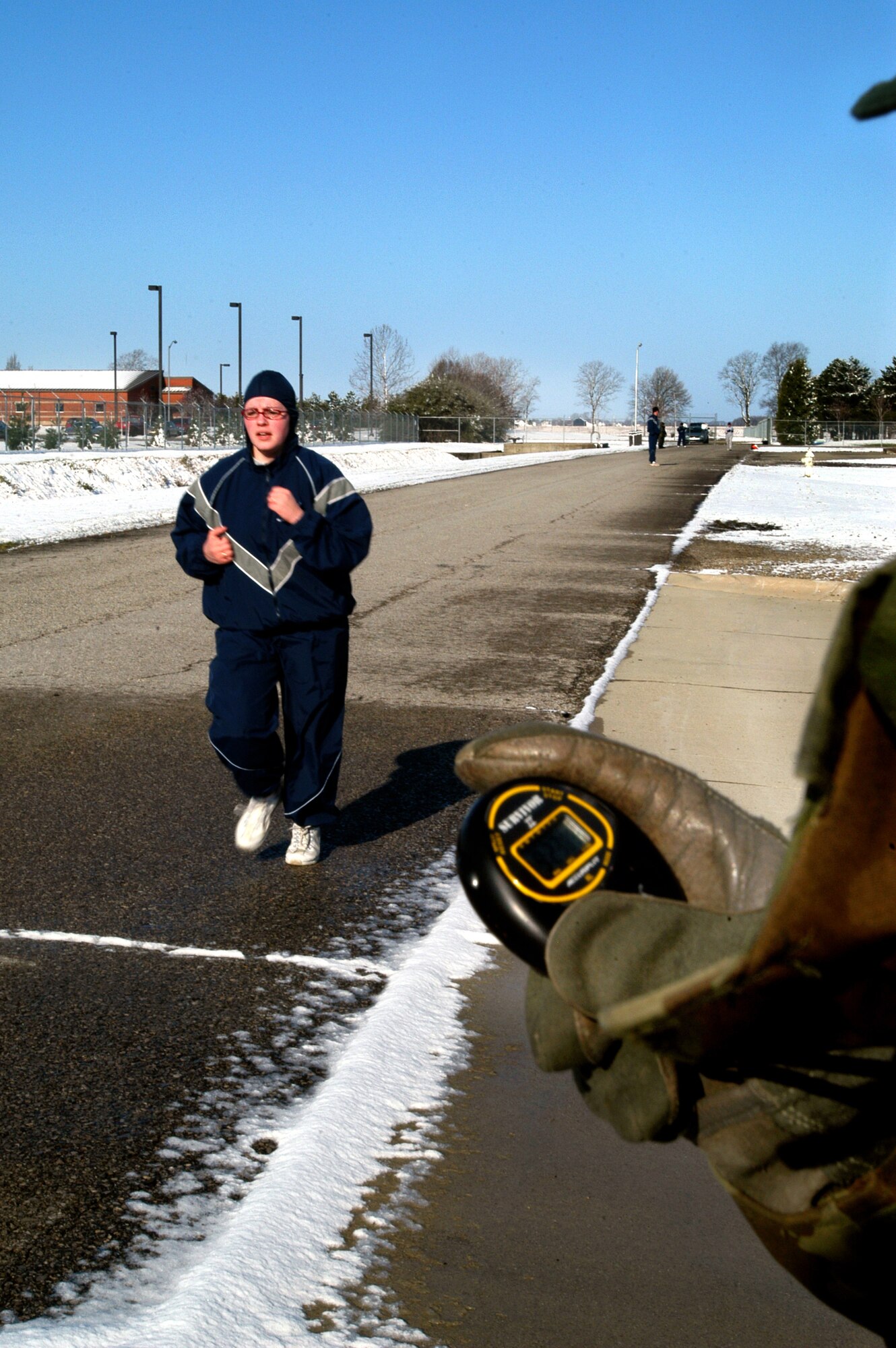 GRISSOM AIR RESERVE BASE, Ind. -- Senior Airman Ann Marie Schwartze races towards the end of her 1.5 mile run April 15, 2007. Airman Schwartze is a supply management apprentice with the 434th Logistics Readiness Squadron. Airmen are required to meet certain yearly fitness requirements and are tested by a 1.5 mile run, a sit-up evaluation and a push-up evlauation, which are all timed. (U.S. Air Force photo/Senior Airman Mark Orders-Woempner)