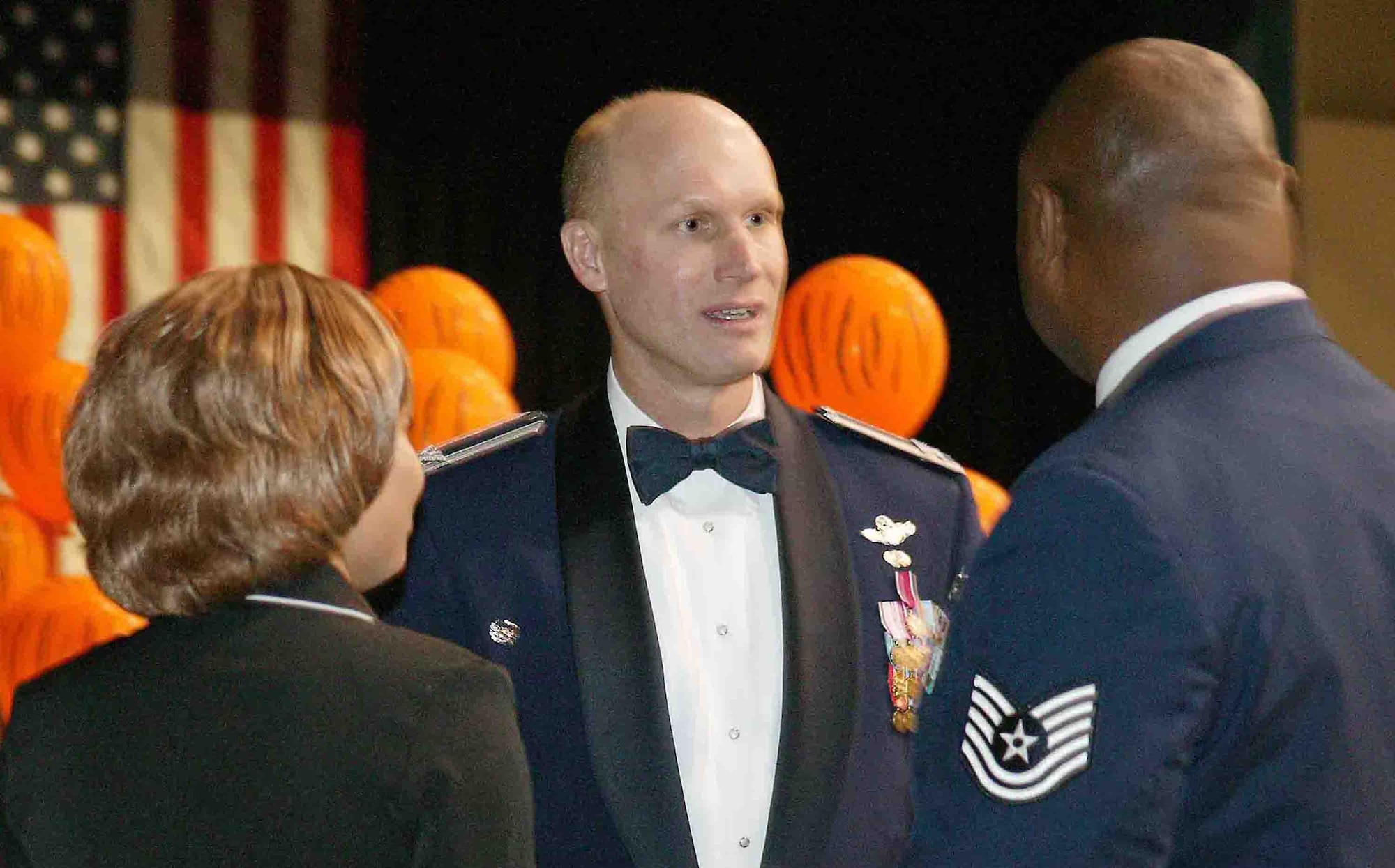 SUMTER, S.C. -- Col. James Post III, 20th Fighter Wing commander, talks to Tech. Sgt. Roosevelt Terry, 79th Aircraft Maintenance Unit, and Sergeant Terry's fiancee, Vernice Glisson, during the 20th Maintenance Group Maintenance Professional of the Year Banquet, April 13 at the Sumter Exhibition Center. The Professional of the Year banquet is held to highlight the contributions of all 20th MXG members and to recognize the most outstanding Airmen within the group. (U.S. Air Force photo/Senior Airman John Gordinier)