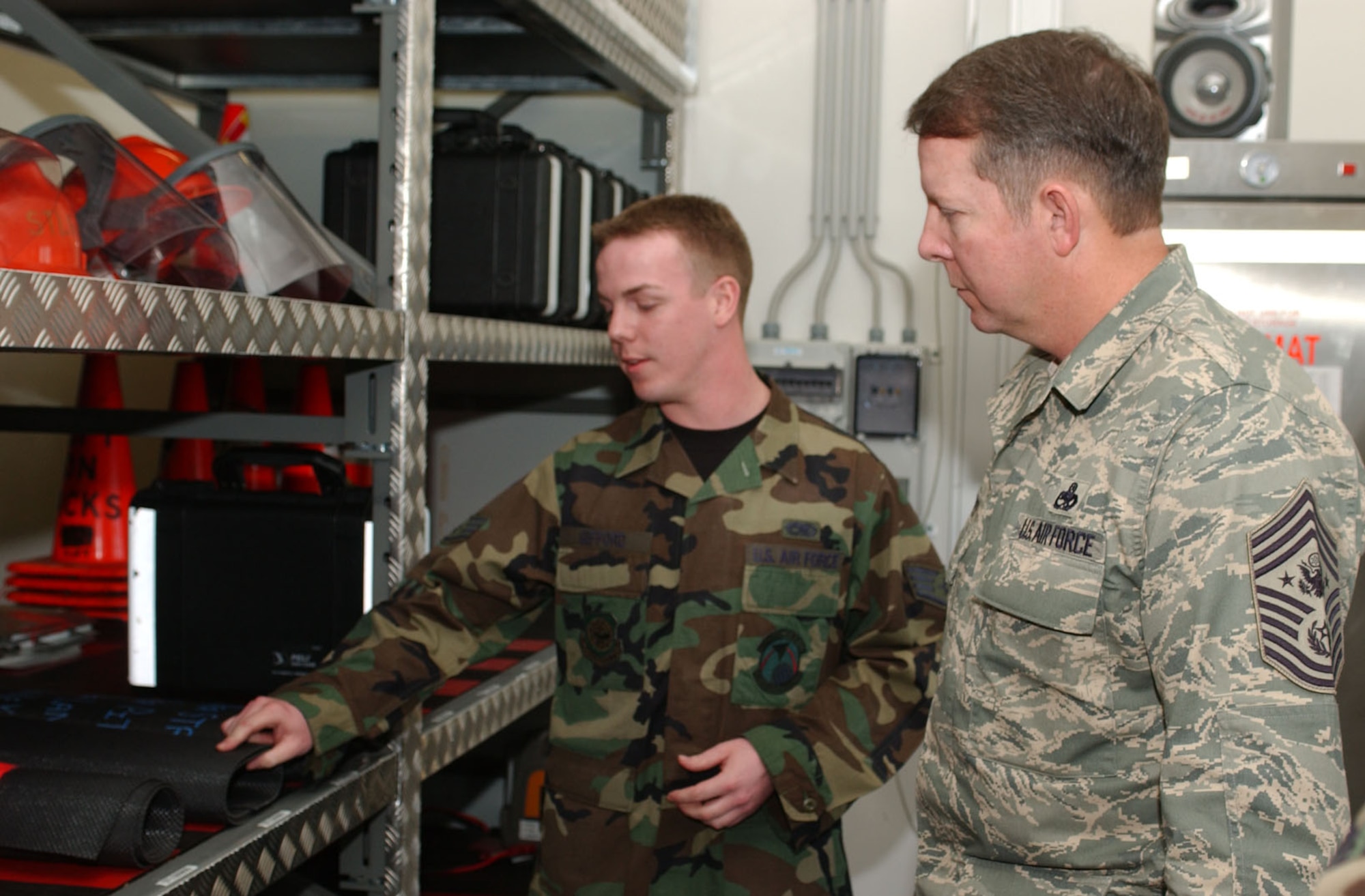 SPANGDHALEM AIR BASE, GERMANY -- Staff Sgt. Olen Gifford, 726th Air Mobility Squadron, explains to Chief Master Sgt. of the Air Force Rodney J. McKinley some of the equipment used by the 726th AMS. (US Air Force photo/Airman 1st Class Stephanie Clark)