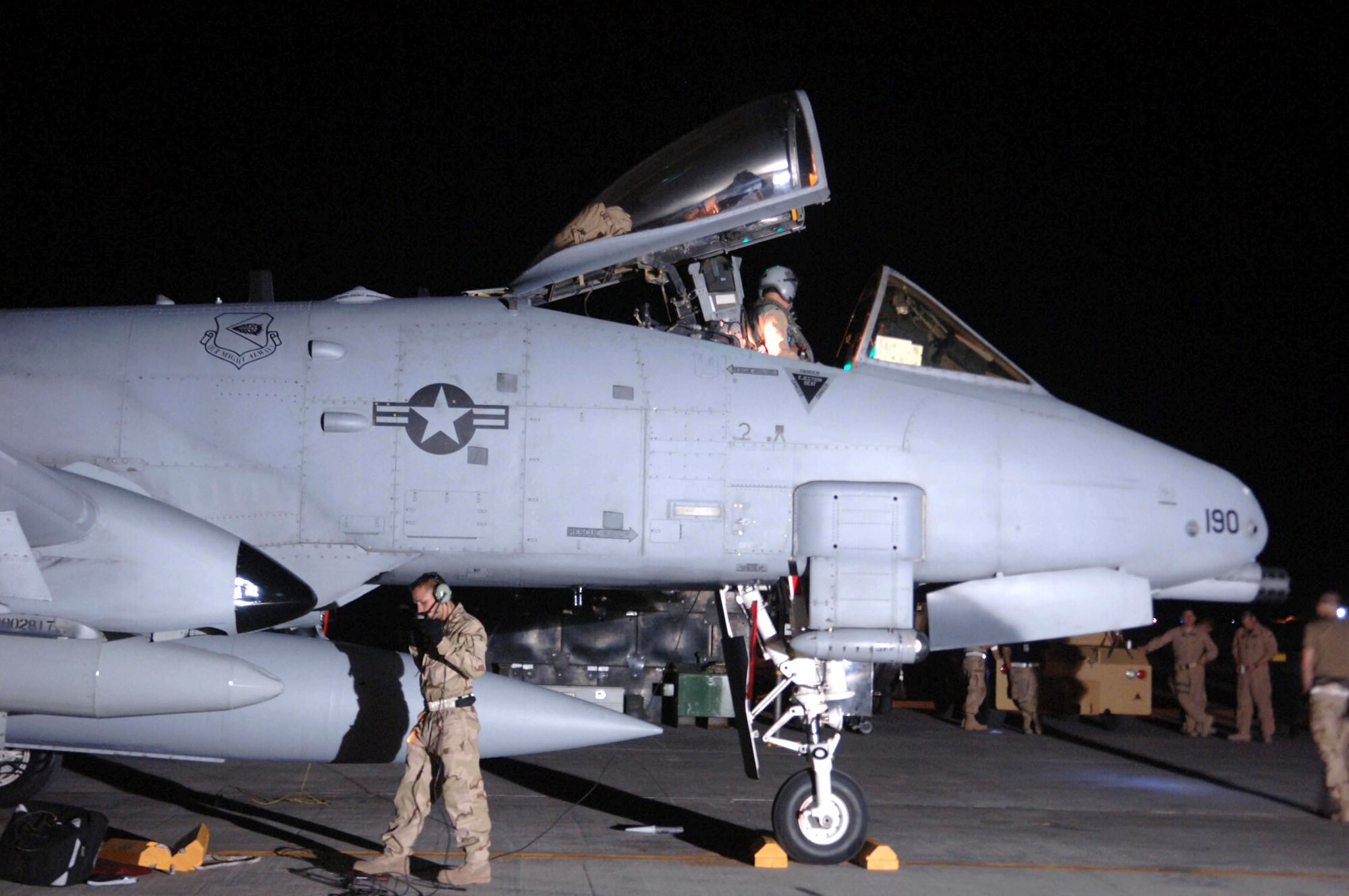 Maintainers recover an A-10 Thunderbolt II as aircrew members wait to greet the pilot after arrival at Bagram Air Base, Afghanistan, April 17. The arrival of A-10s adds a second fighter squadron to the 455th Air Expeditionary Wing. (U.S. Air Force photo/Staff Sgt. Kevin Tomko) 
