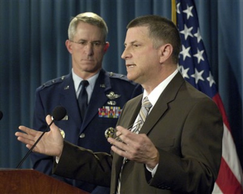 Principal Deputy Under Secretary of Defense for Personnel and Readiness Michael Dominguez (right) conducts a Pentagon press conference to announce a new program designed to recognize and compensate personnel for deployments or mobilizations extending beyond the established rotation policy parameters on April 18, 2007.  Under the program service members will be awarded administrative absence of from one to four days for each month of extended service depending on the actual length of the extended duty.  Vice Director of the Joint Staff Maj. Gen. Stephen M. Goldfein, U.S. Air Force, joined Dominguez for the briefing.  