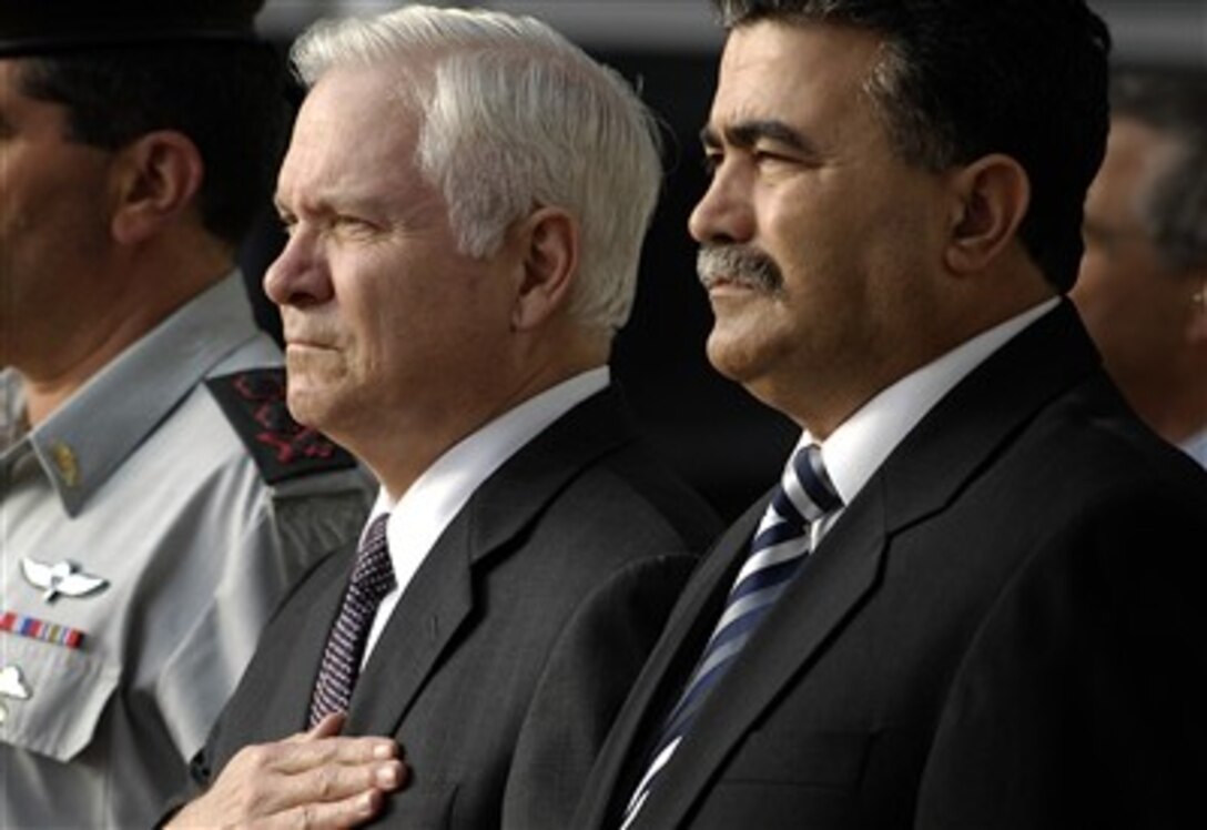 U.S. Defense Secretary Robert M. Gates and Israeli Minister of Defense Amir Peretz listen to the playing of the Israeli and American national anthems  during an honor cordon ceremony in Tel Aviv, Israel, April 18, 2007.