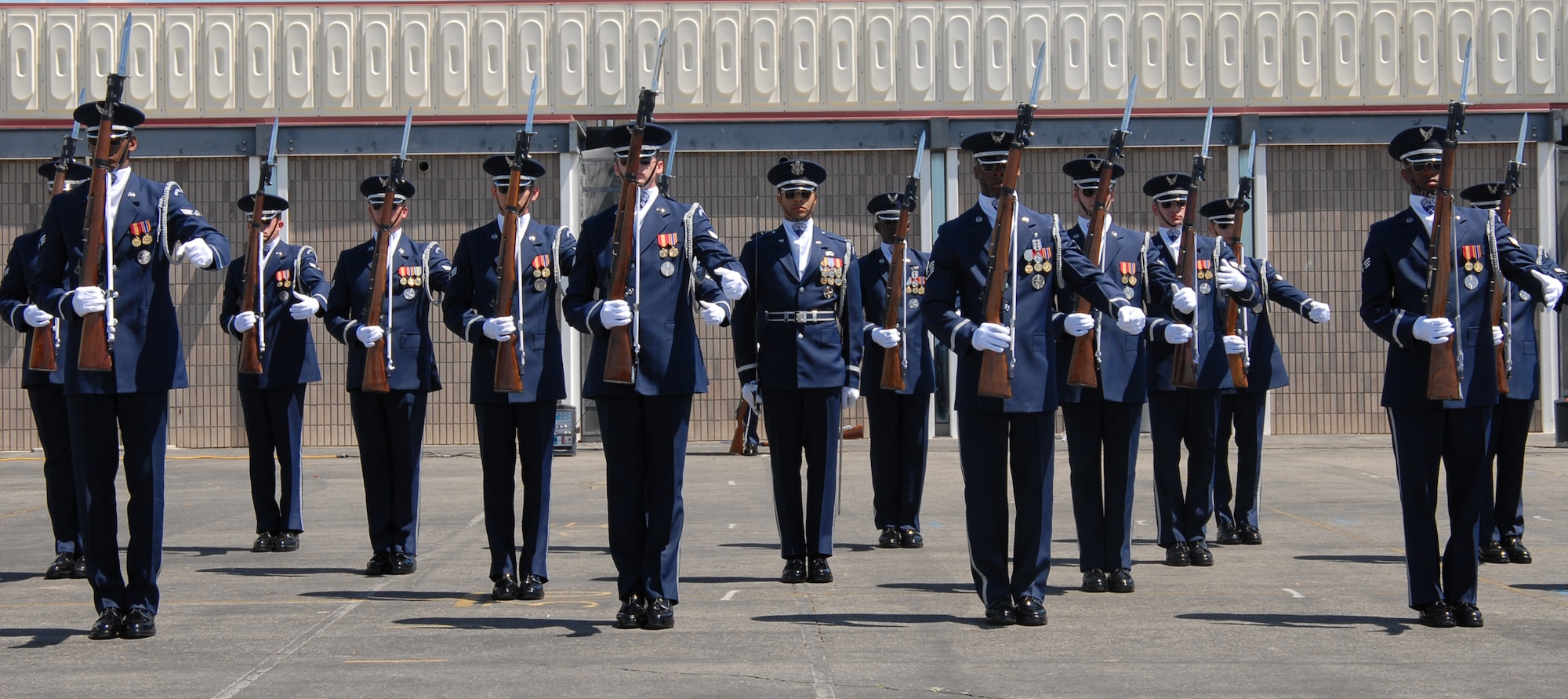 The Air Force Honor Guard performs a 16-man drill at Lancaster High School on Monday. The Air Force Honor Guard drill team travels throughout the United States and overseas to promote the Air Force. They performed at Edwards as well as off base during their two-day visit here. Each drill member performs with M-1 Garande rifles. (Photo by Airman 1st Class Stacy Sanchez)