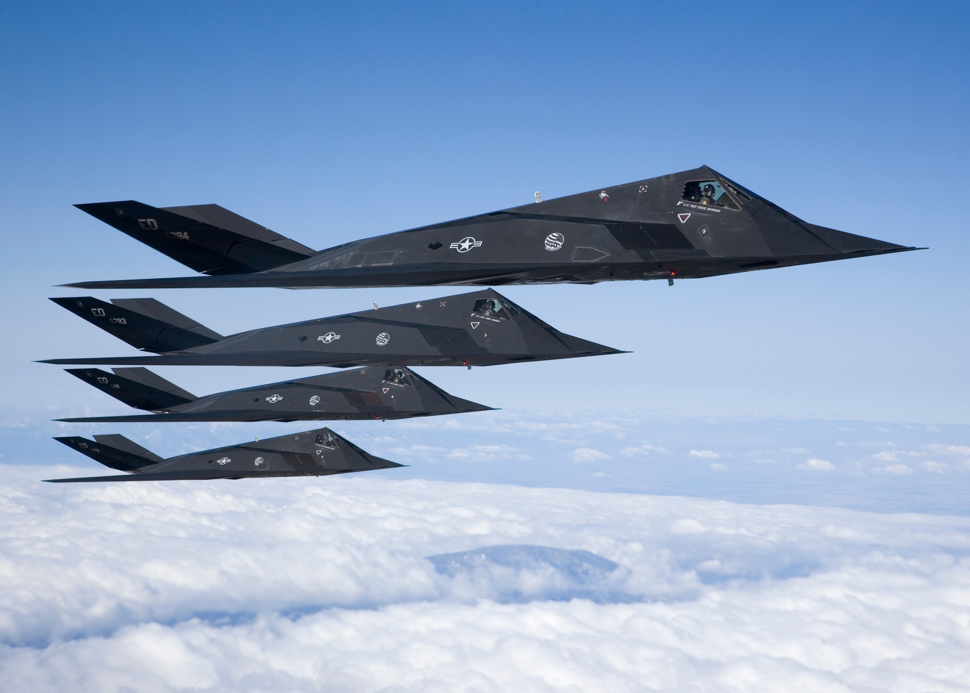 EDWARDS AIR FORCE BASE, Calif. -- Four F-117 Nighthawks fly in formation during a sortie over the Antelope Valley recently. After 25 years of history, the aircraft is set to retire soon. As the Air Force's first stealth fighter, the F-117 is capable of performing reconnaissance missions and bombing critical targets, all without the enemy's knowledge. (Photo by Bobbi Zapka)