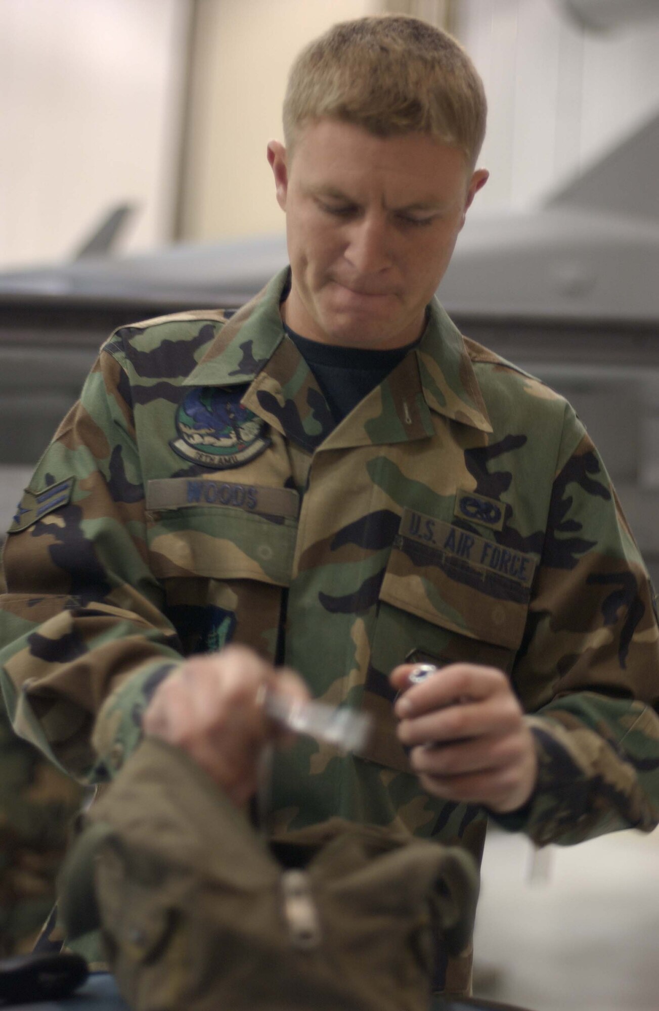 EIELSON AIR FORCE BASE, Alaska -- Airman 1st Class Jeremy Woods, 18th Aircraft Maintenance Unit, 354th Aircraft Maintenance Squadron prepares his tools prior to the Weapons Standardization Load Crew of the Quarter Competition on April 20. The Competition evaluates technical proficiency, safety procedures and overall time. The 18th AMU's overall time was 16 minutes. (U.S. Air Force Photo by Airman Jonathan Snyder) 