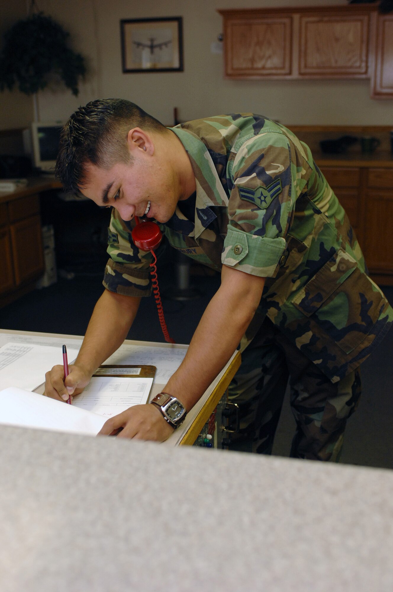 Airman 1st Class Joshua Salsbury, 57th Operations Support Squadron, Airfield Management Office, is the airfield coordinator passes information for inflight or ground emergencies. (U.S. Air Force Photo by Senior Airman Jason Huddleston)