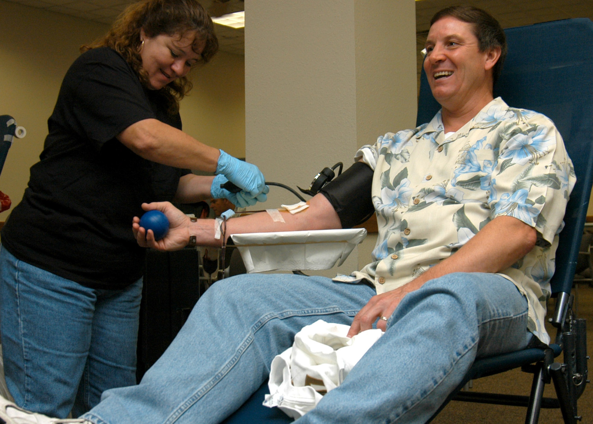 Connie Chapa, a Wilford Hall Donor Center phlebotomist from Lackland Air Force Base, Texas, collects blood from Rick Boshart during an Air Force Recruiting Service Blood Drive April 20 on Randolph AFB, Texas. Donations collected during the drive boost supplies for the Armed Services Blood Donor Program, which supports Operation Iraqi and Enduring Freedom operations, military retirees and family members, and patients of Wilford Hall Medical Center and Audie L. Murphy Veterans Memorial Hospital. Mr. Boshart is a member of the AFRS Support Division.  (U.S. Air Force photo by Staff Sgt. Jennifer Lindsey)