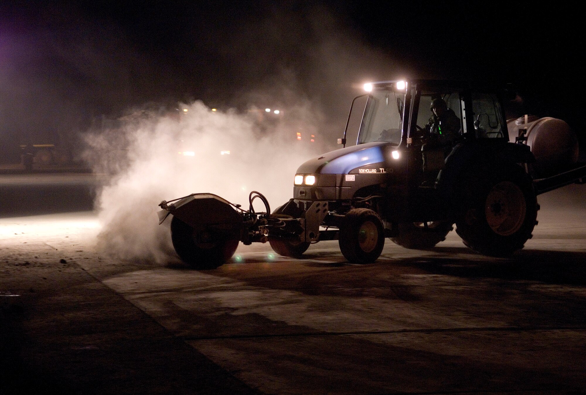 A member of the 8th Civil Engineer Squadron Airfield Damage Repair team clears debris from the runway surface April 19 at Kunsan Air Base, South Korea.The ADR teams do everything from crater repair to airfield lighting making it possible to get aircraft back in the air quickly. Kunsan AB is currently undergoing an operational readiness inspection to test the 8th Fighter Wing's ability to conduct its wartime mission. (U.S. Air Force Photo/Master Sgt Jack Braden)