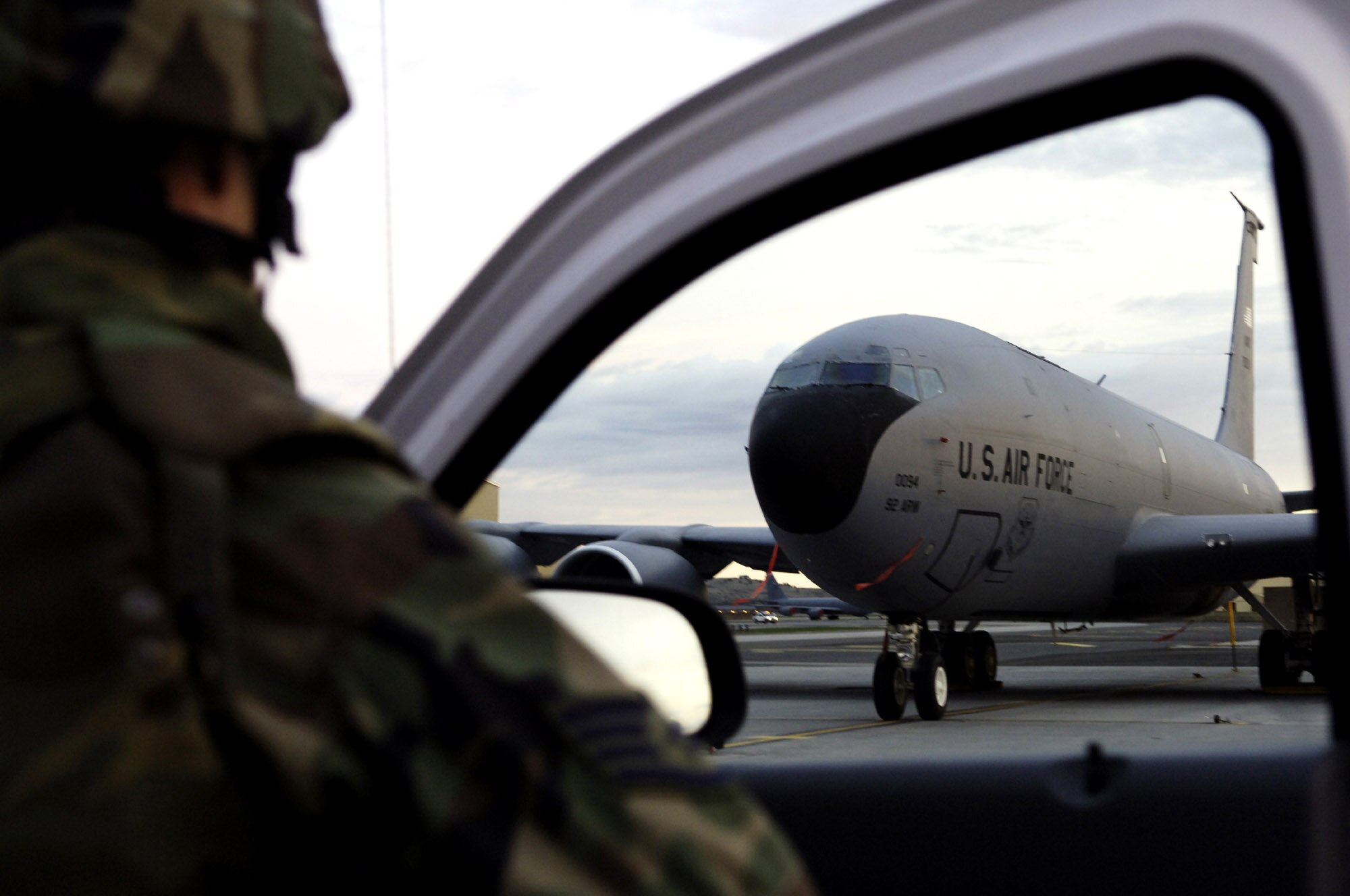 A member of the 92nd Security Forces Squadron takes cover and provides over-watch while participating in a simulated aircraft hijacking during an exercise April 18 at Fairchild Air Force Base, Wash. Tech. Sgt. Joel Jones and Tech. Sgt. Cliff Spry, both of the 92nd Maintenance Group, disguised themselves as terrorists and attempted to infiltrate the flightline, taking one maintenance Airman hostage before being apprehended by security forces. (U.S. Air Force photo/Senior Airman Anthony Ennamorato)