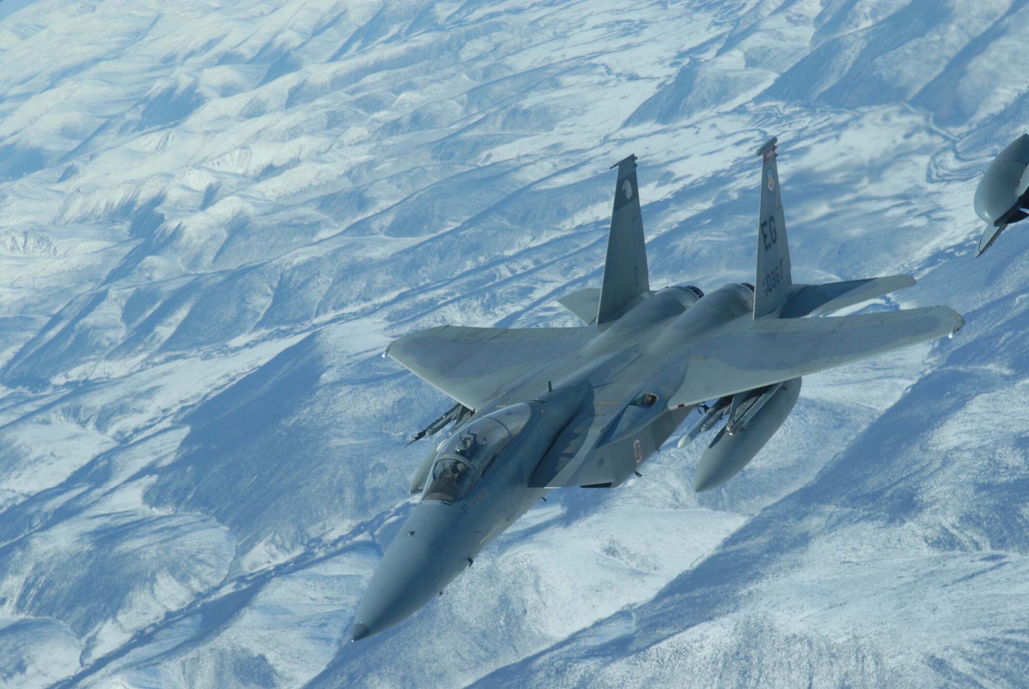 EIELSON AIR FORCE BASE, Alaska -- An F-15 Strike Eagle, 60th Fighter Squadron, Eglin AFB, Florida, breaks away after receiving fuel from a KC-10 extender over the Pacific Alaska Range Complex on April 18 during Red Flag-Alaska 07-1. Red Flag-Alaska is a Pacific Air Forces-directed field training exercise for U.S. forces flown under simulated air combat conditions. It is conducted on the Pacific Alaskan Range Complex with air operations flown out of Eielson and Elmendorf Air Force Bases. (U.S. Air Force Photo by Airman 1st Class Jonathan Snyder) 