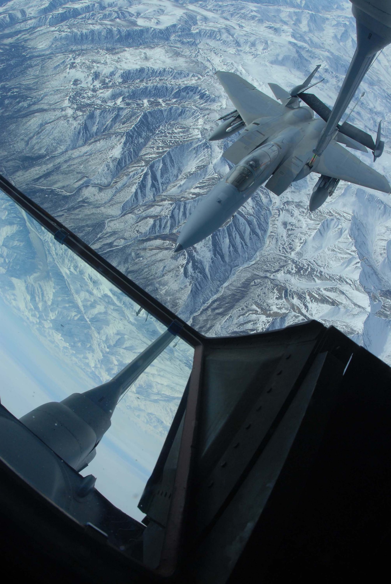 EIELSON AIR FORCE BASE, Alaska -- An F-15 Strike Eagle, 60th Fighter Squadron, Eglin AFB, Florida, receives fuel from a KC-10 extender over the Pacific Alaska Range Complex on April 18 during Red Flag-Alaska 07-1. Red Flag-Alaska is a Pacific Air Forces-directed field training exercise for U.S. forces flown under simulated air combat conditions. It is conducted on the Pacific Alaskan Range Complex with air operations flown out of Eielson and Elmendorf Air Force Bases. (U.S. Air Force Photo by Airman 1st Class Jonathan Snyder) 