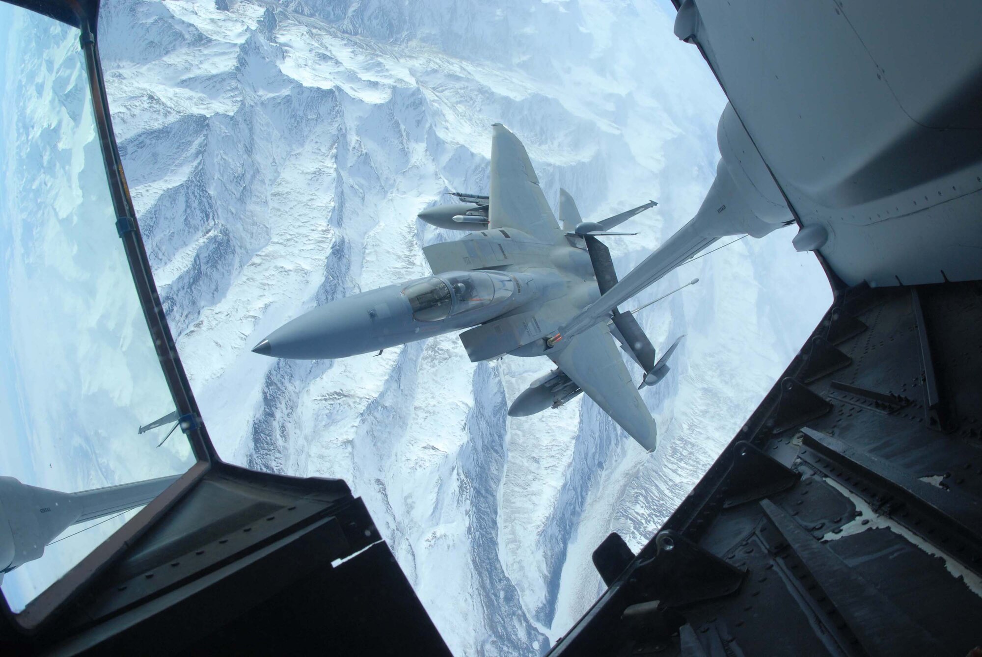EIELSON AIR FORCE BASE, Alaska -- An F-15 Strike Eagle, 60th Fighter Squadron, Eglin AFB, Florida, receives fuel from a KC-10 extender over the Pacific Alaska Range Complex on April 18 during Red Flag-Alaska 07-1. Red Flag-Alaska is a Pacific Air Forces-directed field training exercise for U.S. forces flown under simulated air combat conditions. It is conducted on the Pacific Alaskan Range Complex with air operations flown out of Eielson and Elmendorf Air Force Bases. (U.S. Air Force Photo by Airman 1st Class Jonathan Snyder) 