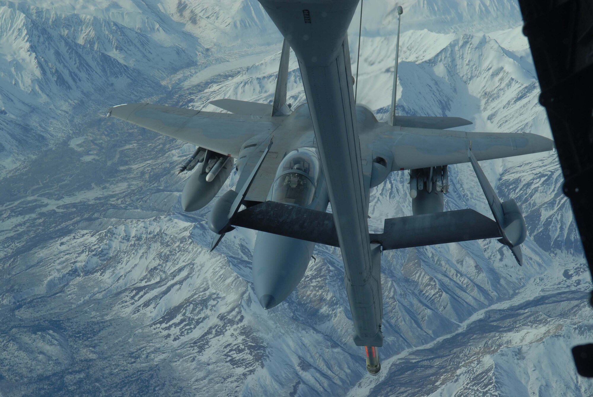 EIELSON AIR FORCE BASE, Alaska -- An F-15 Strike Eagle, 60th Fighter Squadron, Eglin AFB, Florida, sits in pre-contact position awaiting fuel from a KC-10 extender over the Pacific Alaska Range Complex on April 18 during Red Flag-Alaska 07-1. Red Flag-Alaska is a Pacific Air Forces-directed field training exercise for U.S. forces flown under simulated air combat conditions. It is conducted on the Pacific Alaskan Range Complex with air operations flown out of Eielson and Elmendorf Air Force Bases. (U.S. Air Force Photo by Airman 1st Class Jonathan Snyder)